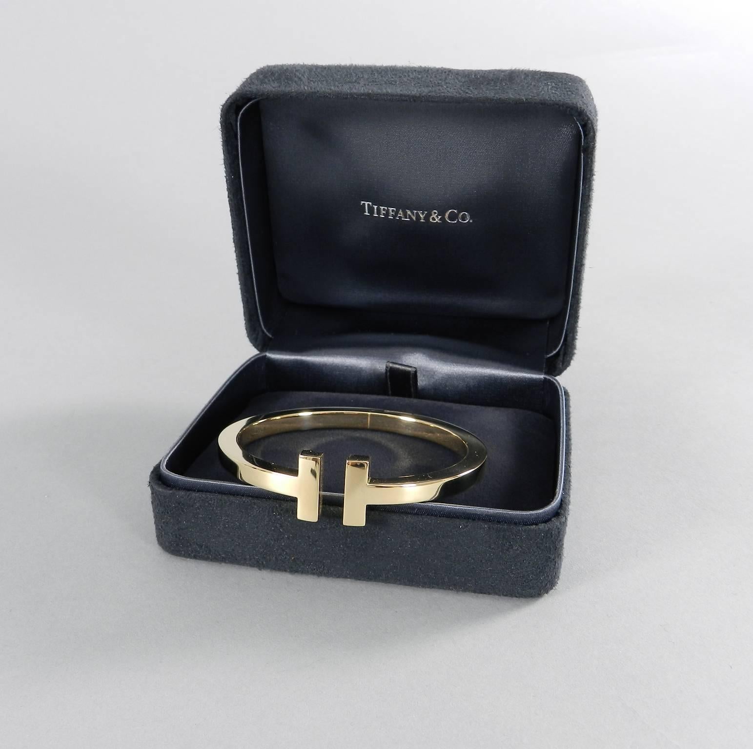Tiffany & Co. 18k yellow gold medium T bracelet. Brand new in box. About 5/8