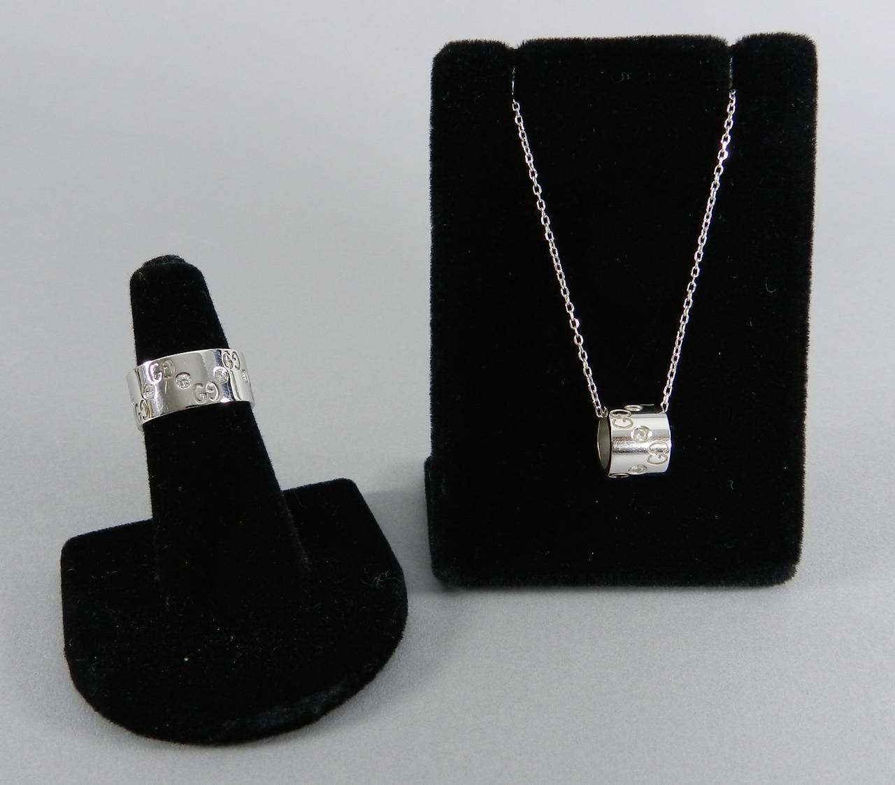 Gucci 18k white gold and diamond ring and pendant necklace set.  Excellent pre-owned condition. Ring is 3/8