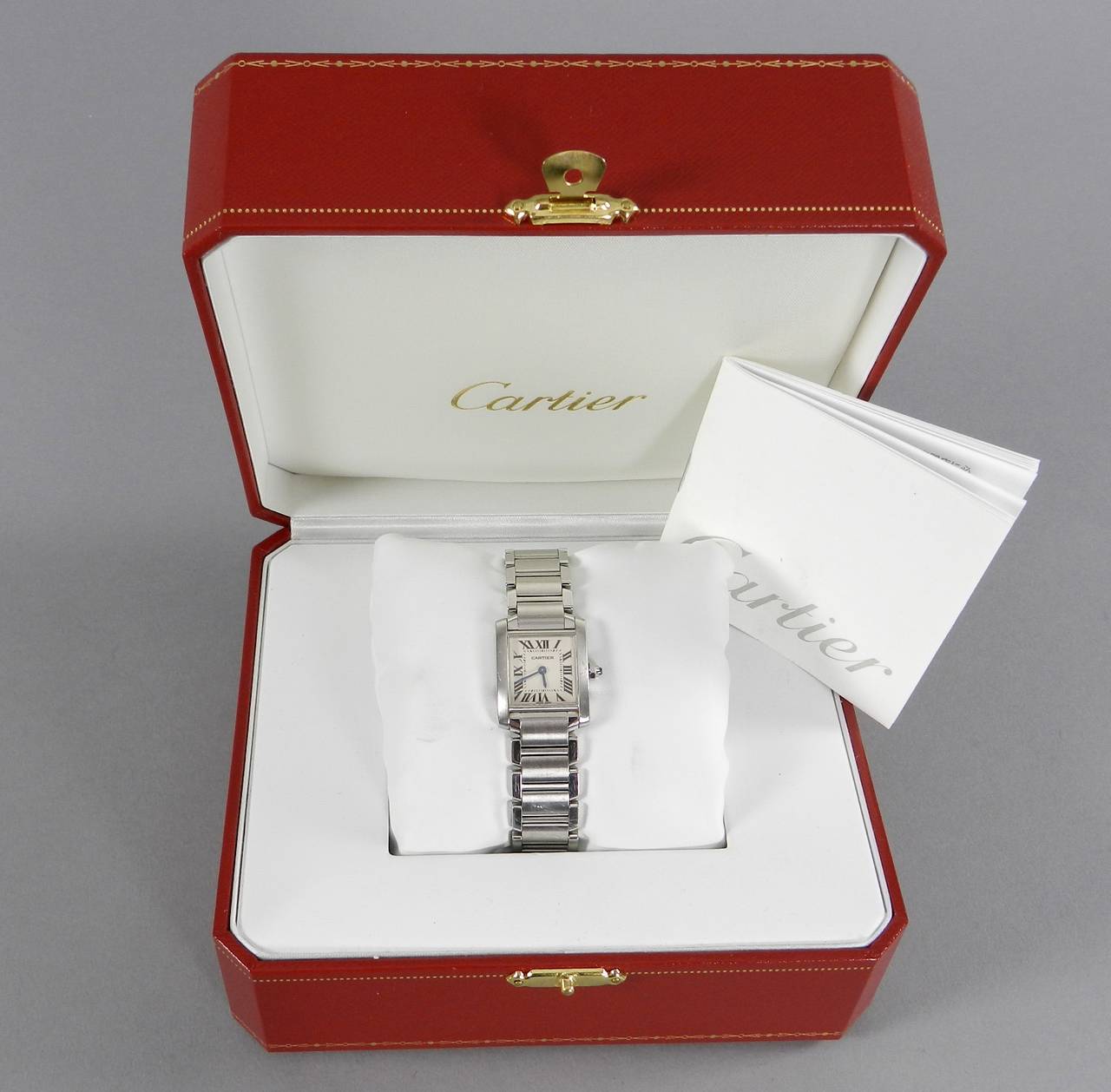 Cartier Tank Francaise ladies stainless steel watch.  With original box and booklet. No original receipt or papers. Serial number BB112761.  Front face measures 7/8
