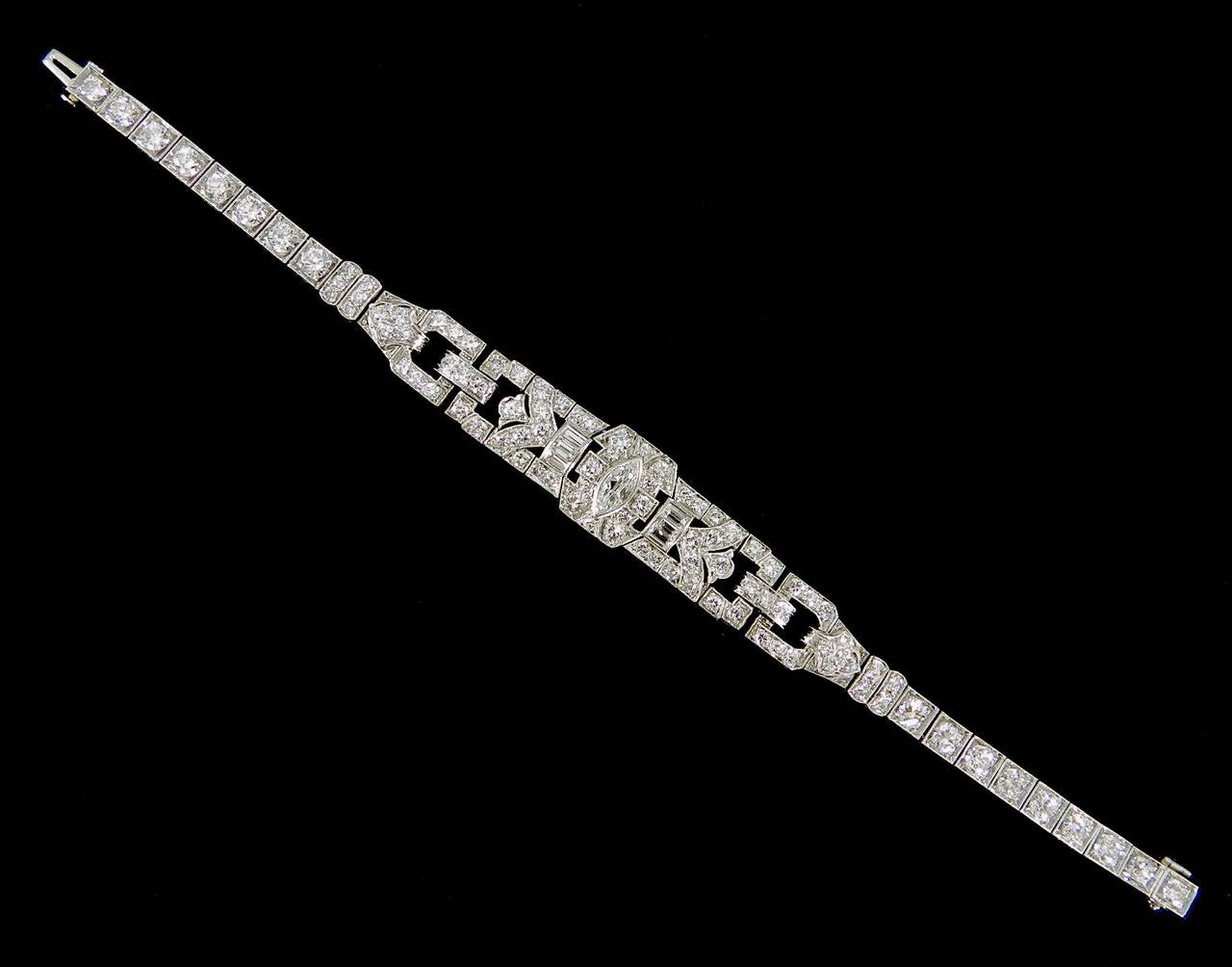 Art Deco platinum and diamond bracelet. Centre diamond (0.5 carat) plus other diamonds (6.25 carats) equals 6.75 carat total weight.  Bracelet weighs 22.2 grams. Interior circumference 6.5