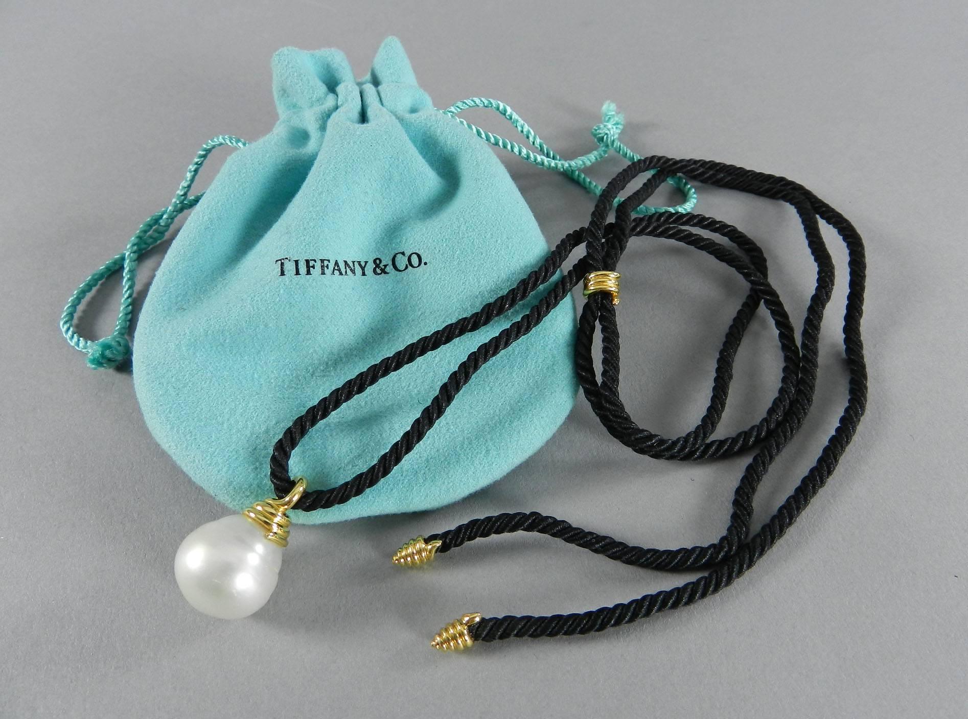 Tiffany & Co. south sea pearl necklace on cord. 18k yellow gold. Adjustable length with maximum 38