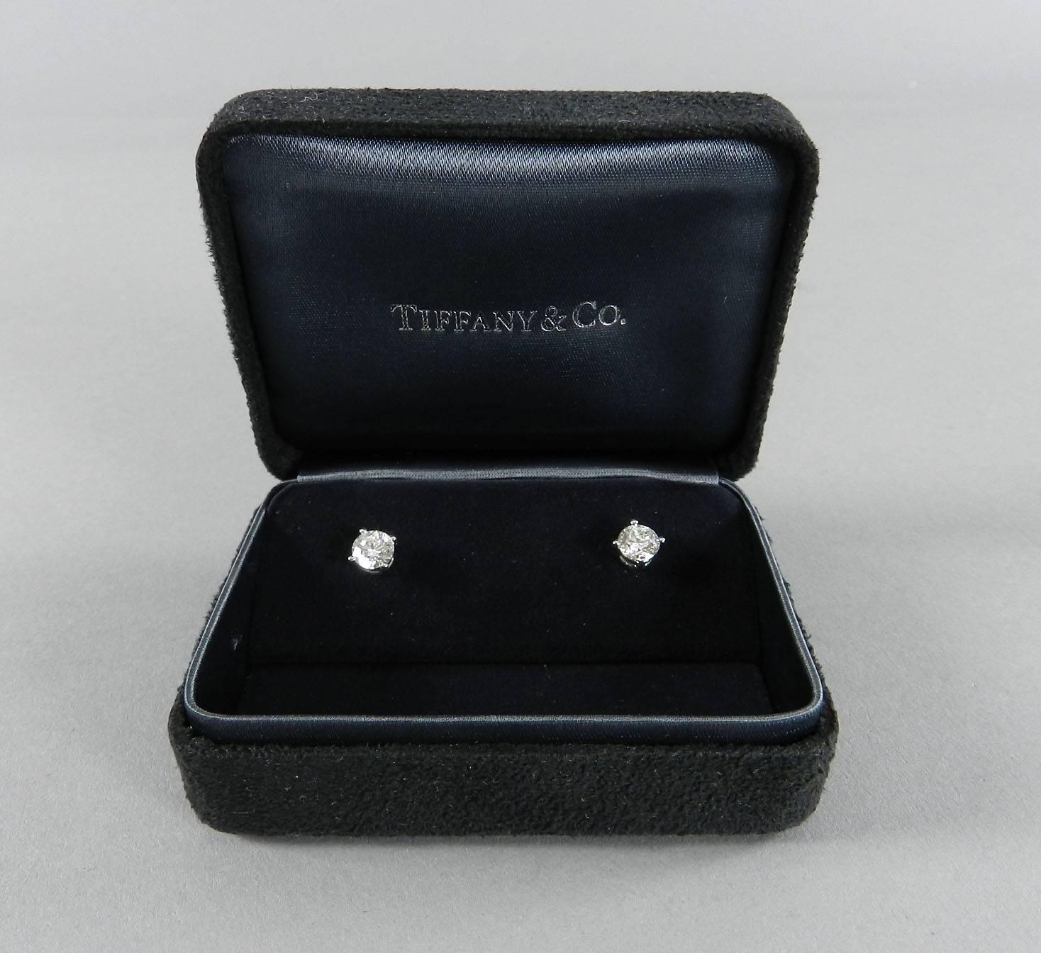 Tiffany & Co. diamond and platinum solitaire stud earrings in box. 1.58 tcw. Hallmarked T & Co. and PT 950, with serial number on side profile. G color and VS1 Clarity. Original retail $20,000+. Original owner did not bring Tiffany certificated in,