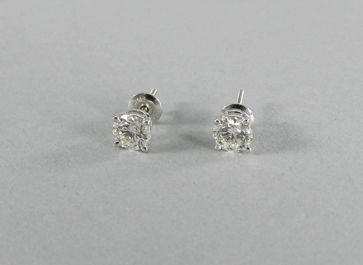 Tiffany & Co. Diamond Platinum Solitaire Stud Earrings In Excellent Condition In Toronto, Ontario