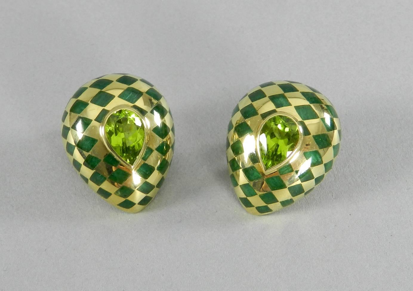 Angela Cummings 18k yellow gold, peridot, and malachite inlay clip earrings. Vintage circa 1980's. Hallmarked (c) Angela Cummings 750. Each earring measures about 1 1/8" x 7/8". Total weight 20.7 grams.

Shipping prices provided are for