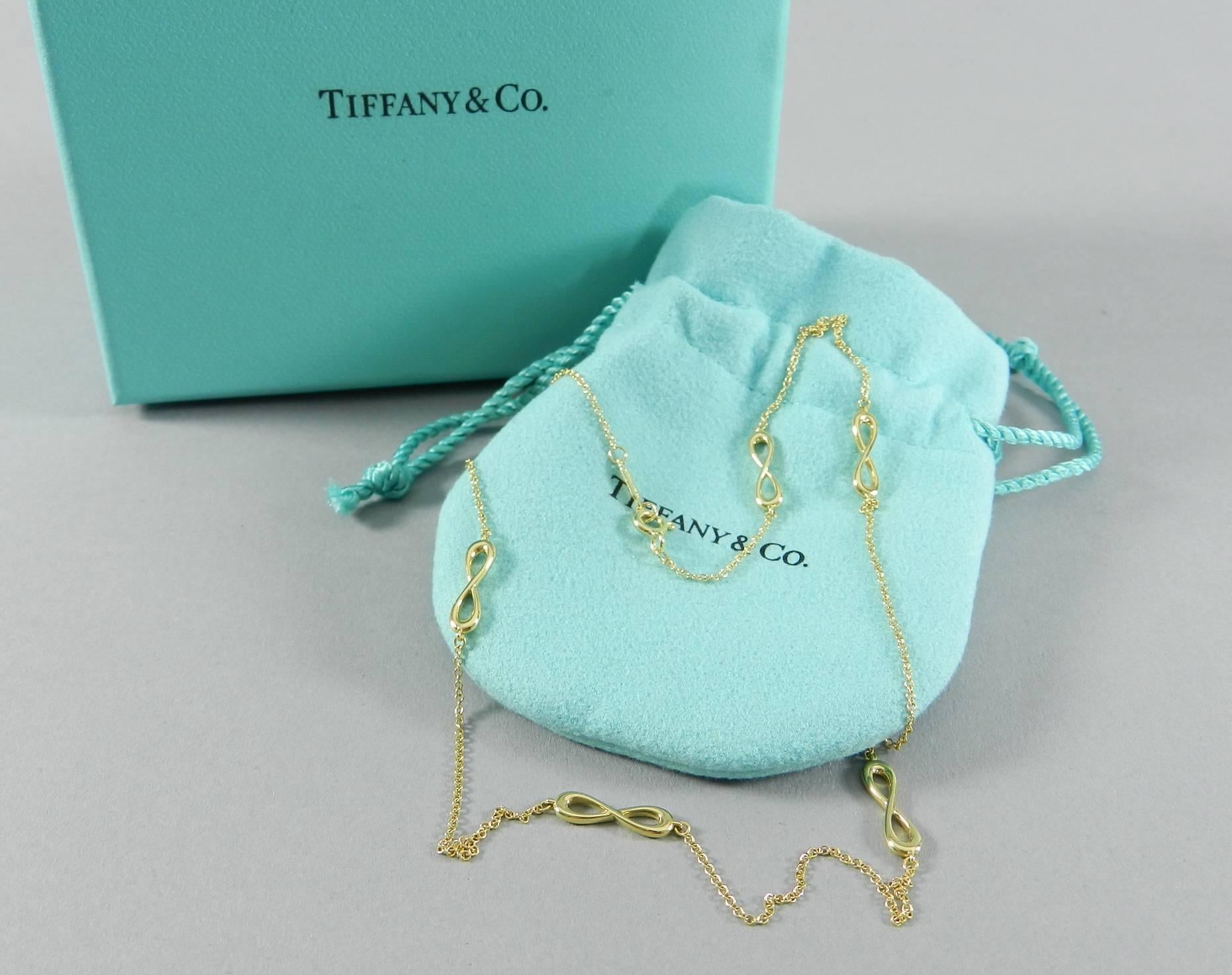 Tiffany and Co. 18k yellow gold infinity collection endless necklace. New and unworn with pouch and box. 18