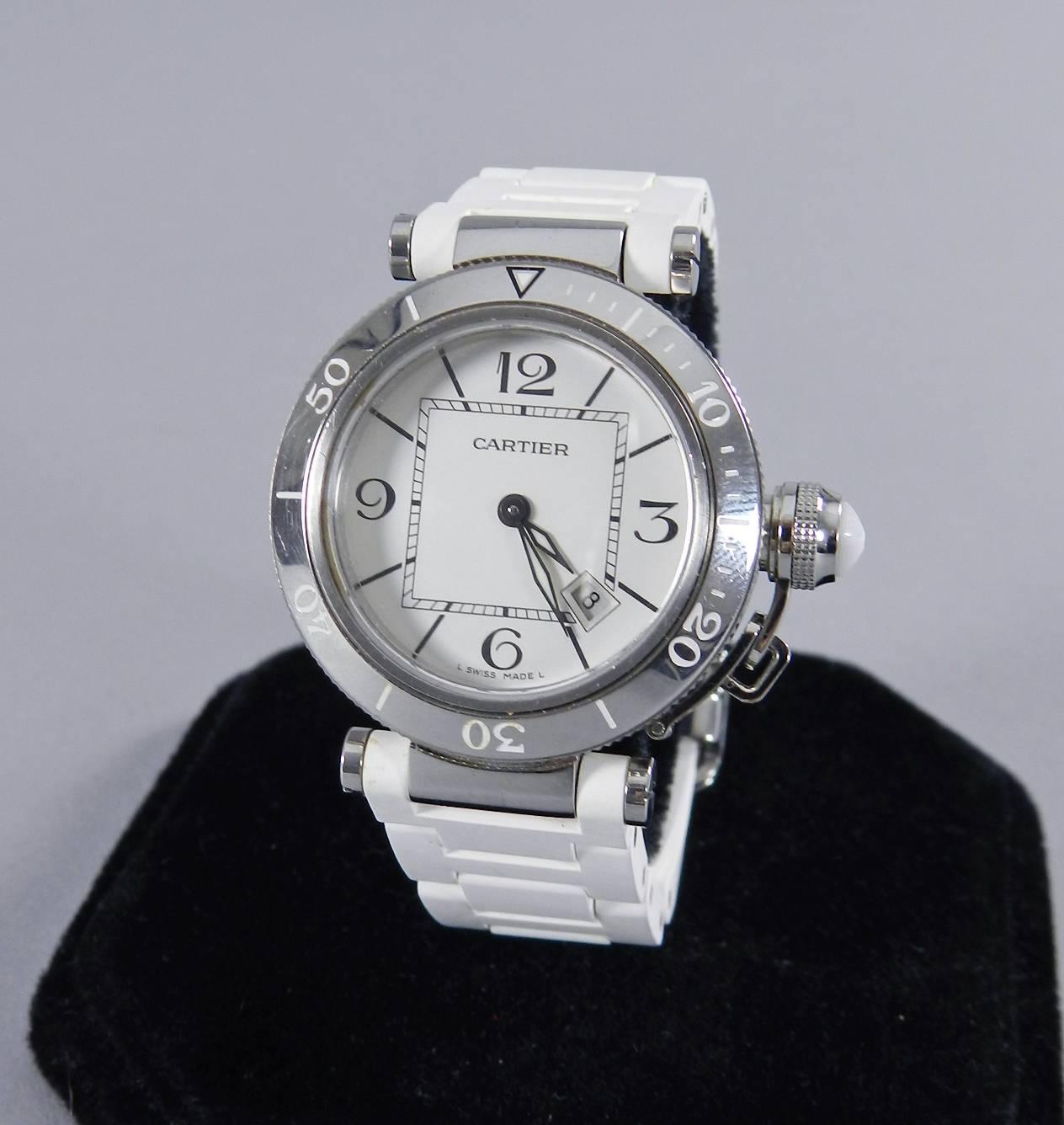 Cartier Pasha Seatimer ladies watch.  33mm face, quartz movement, white rubber band.  Circa 2011.  Excellent pre-owned condition. No original box or papers. Original retail was $4400 USD.

We ship worldwide.

