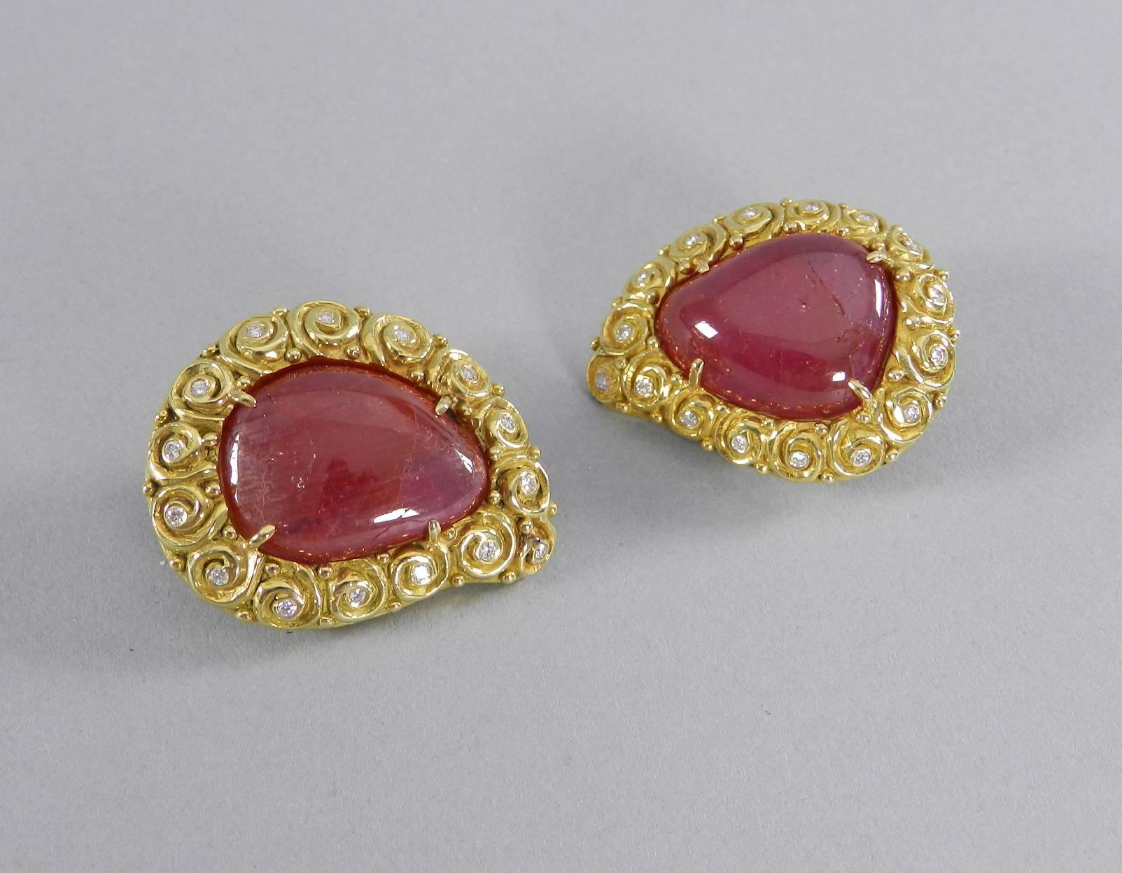 Verdura 18k yellow gold, ruby, diamond clip earrings. 15 diamonds, ruby cabochon, tear drop shaped design.  Total weight 463 grams.  Signed Verdura 18k.  Measures approximately 35 mm x 28 mm.

We ship worldwide. 