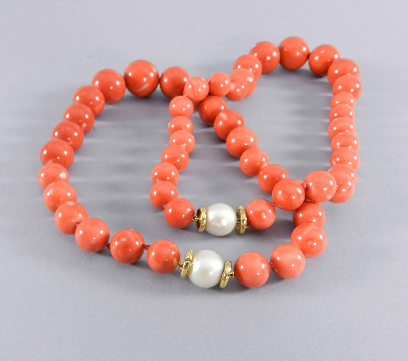 Trianon set of two coral beaded necklaces with 18k gold and pearl clasps. High quality graduated beads measuring 12mm to 22mm and finished with a 13mm pearl clasp and 18k yellow gold setting. Unsigned but original owner purchased these at Trianon