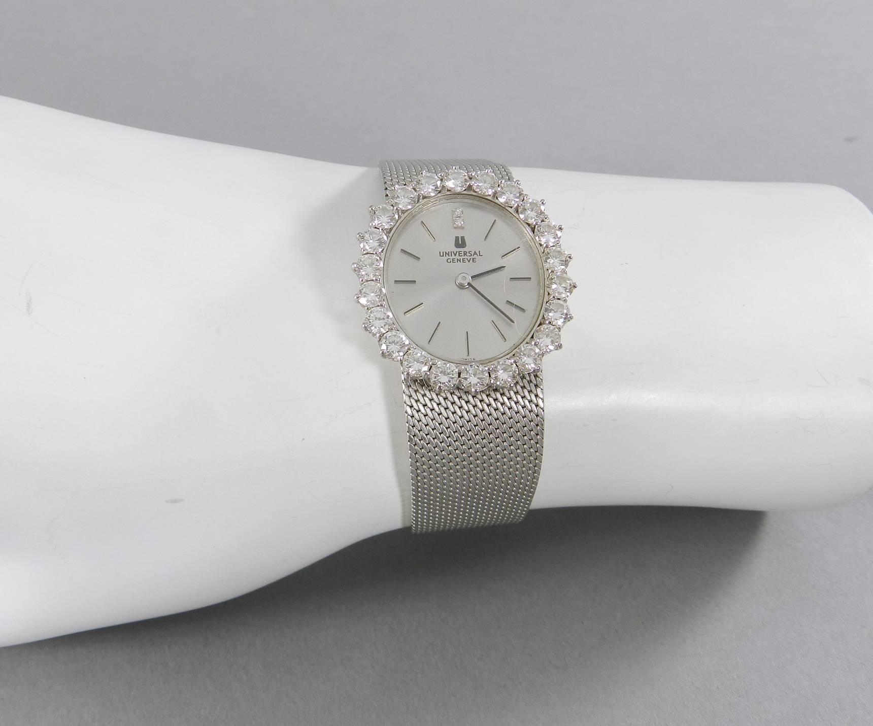 1960s Universal Geneve 18k White Gold Diamond Ladies Wrist Watch.  Excellent condition from the late 1960's. Manual wind up watch keeps time well. Hallmarked 750 and is 18K white gold.  22 Diamonds approx. 15 points each, totalling approx. 3 carats