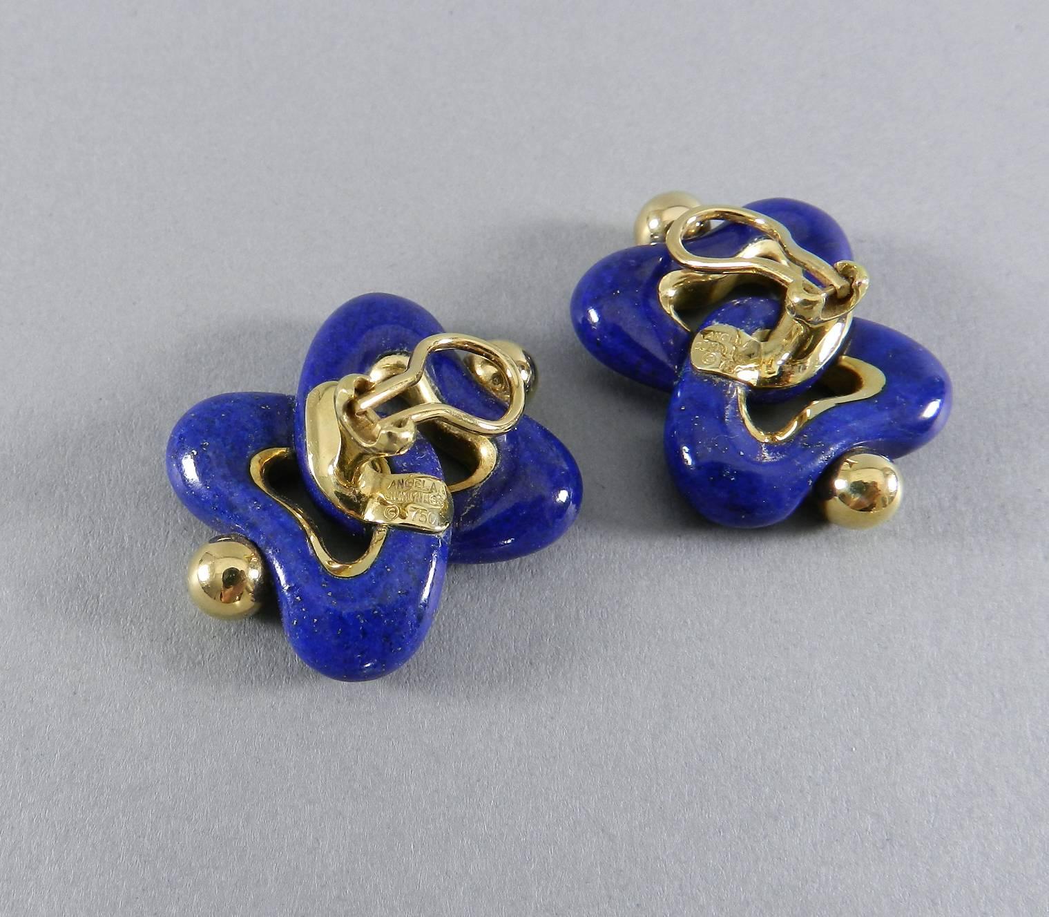 Angela Cummings lapis lazuli and 18k gold clip earrings.  1.25” x 1”.  Hallmarked “Angela Cummings © 750”.  Clip back. 24.8 grams.

We ship worldwide.
