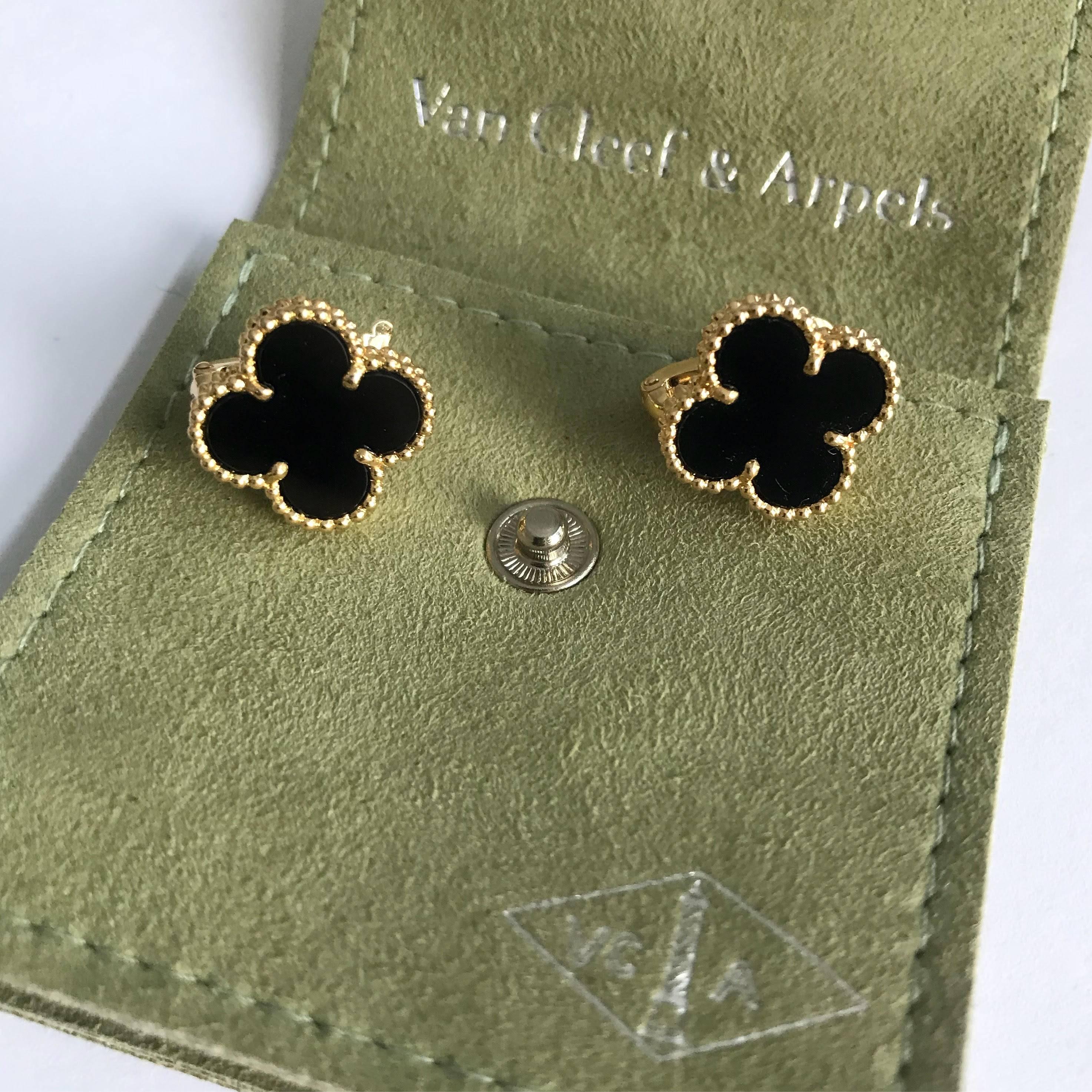 Van Cleef and Arpels Vintage Alhambra Black Onyx 18k Gold Clip Earrings.  Measures 15mm across or 0.59 inches.  Fully hallmarked on back of clip 750 VCA and Serial number. Peirced post earrings with additional leverback.  Excellent pre-owned