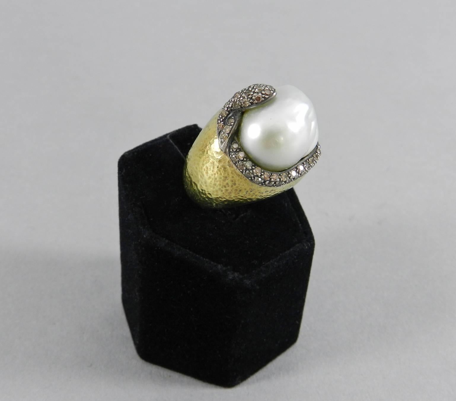 Bold 18k yellow gold cocktail ring with diamond snake wrapped around a baroque south sea pearl centre.  Blackened silver snake set with 75 brown pave diamonds.  Large baroque south sea pearl measures about 17 x 15 x 8mm.  Approximately 1.25 ctw
