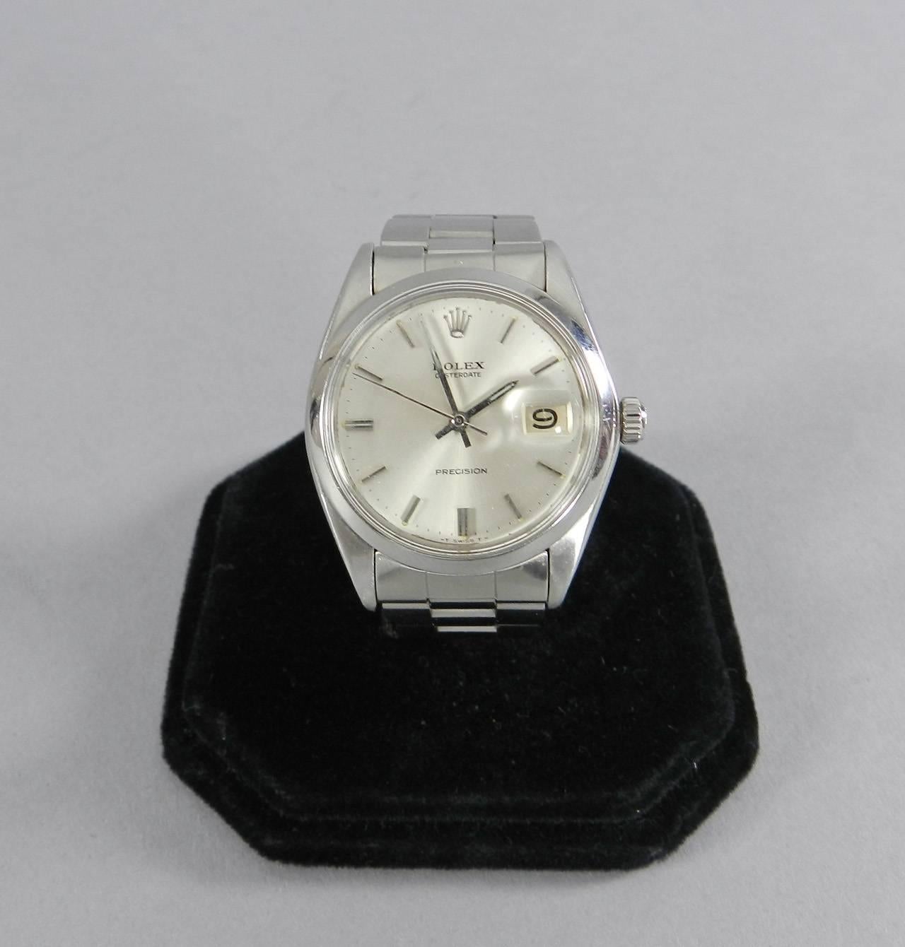 Rolex vintage 1970's Oyster Date Precision Stainless Steel 34mm Watch. Was originally sold as a men's watch but strap will fit maximum 6.5" circumference wrist so is likely best worn as a women's watch.  Extra links, original papers, and