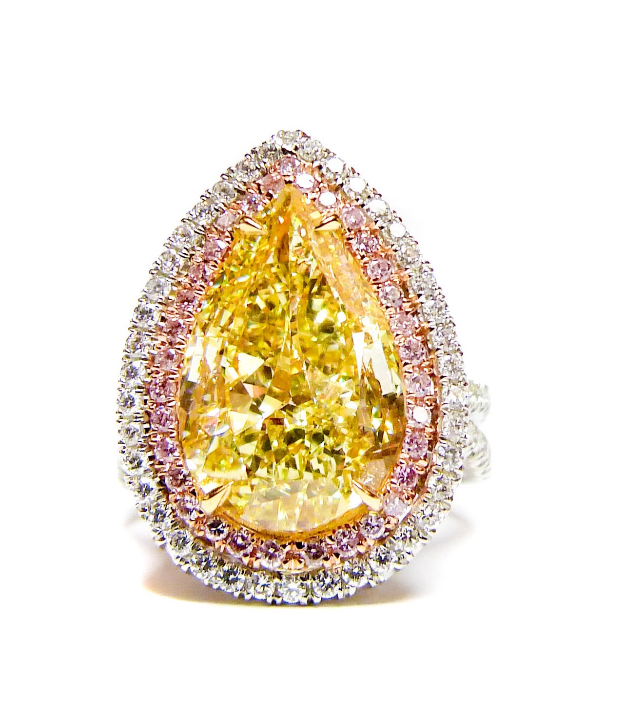 Beautiful Fancy Yellow Engagement Ring, features 6.02 Carat Fancy Yellow Pear Shape Diamond, SI1 in Clarity. Certified by GIA Laboratory. 

The diamond looks like 8 Carats based on proportions. 

The center stone is surrounded by micropave pink