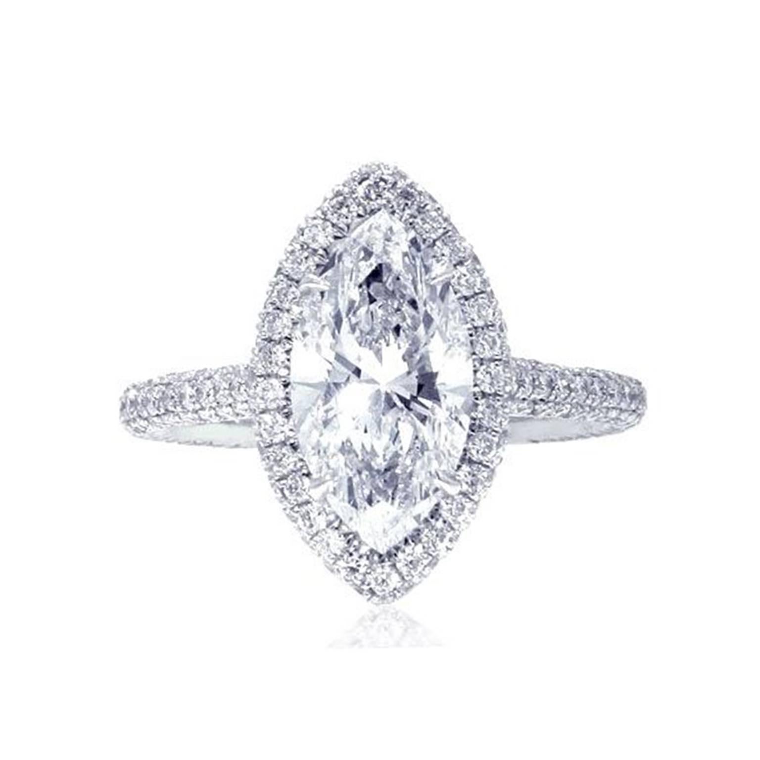 Stunning Platinum Engagement Ring with 2.00 Carats GIA Certifies D-VS1 Marquise Diamond surrounded by 1.26 Carats of side Diamonds. Comes in 6 size.