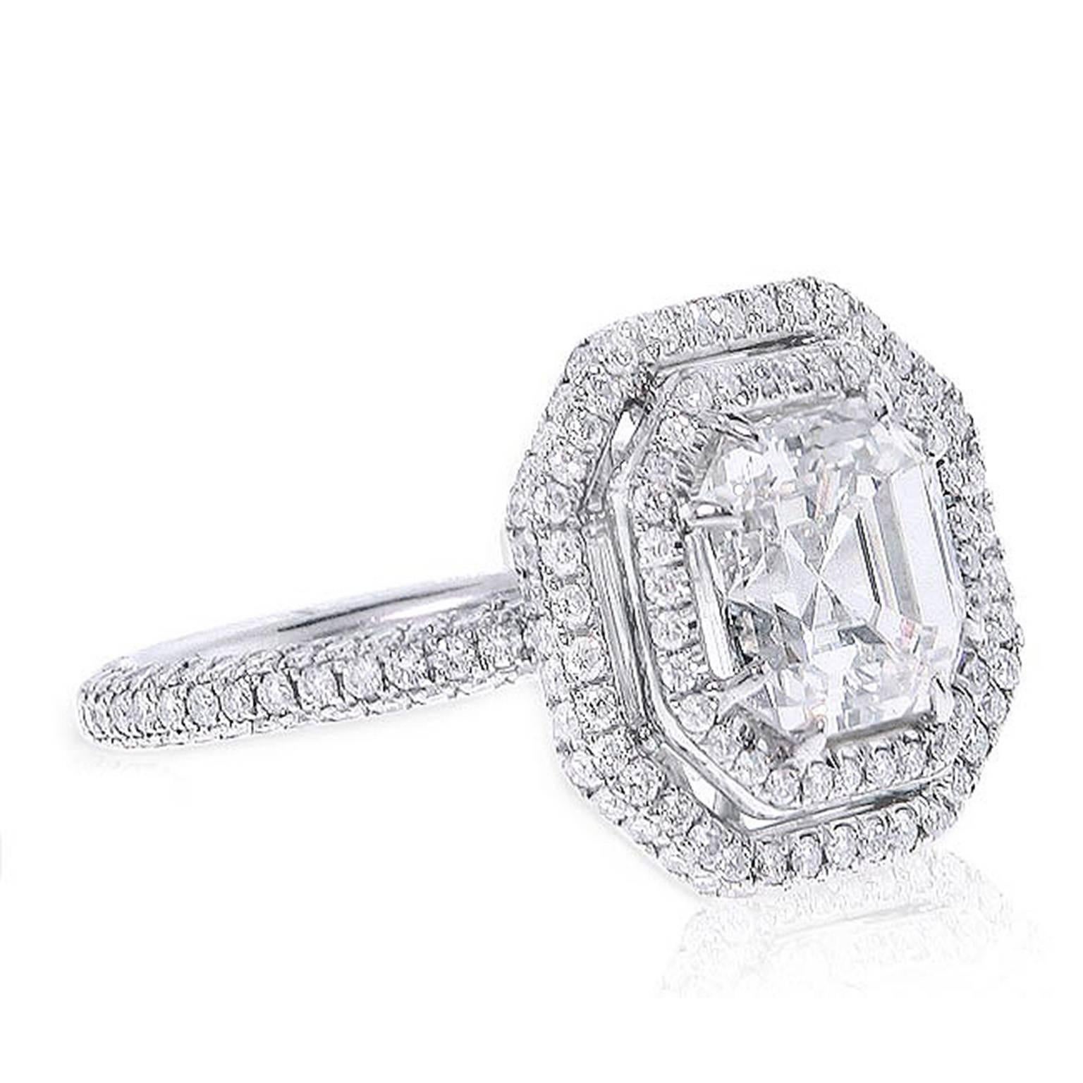 One GIA Certified Platinum Diamond Engagement Ring, Features 3.01 Carats Asscher Cut Diamond I Color VS1 in Clarity GIA Certified, GIA#13331517 set in Platinum with double Halo Featuring 1.40 Carats of two Row Round Pave Diamonds. Comes in 6 size.