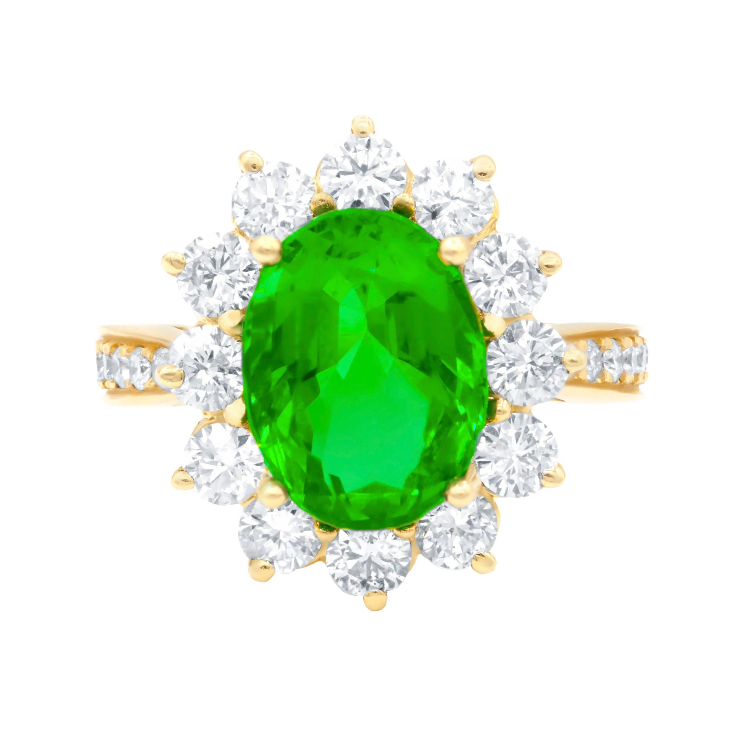 This beautiful Princess Diana Style 18k Yellow Gold Ring features GIA Certified Gem Quality Bright Color 4.20 Carats Oval Shaped Green Emerald in Halo by Round Diamonds and Side Diamonds in 1.80 Carats of Total Diamond Weight comes in size 7. 