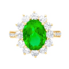 GIA Certified 4.20 Carat Green Emerald in Halo by 1.80 Carat of Diamonds Ring
