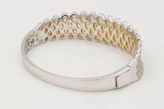 Infinity Swirl Diamond Bangle Bracelet in White and Yellow Gold