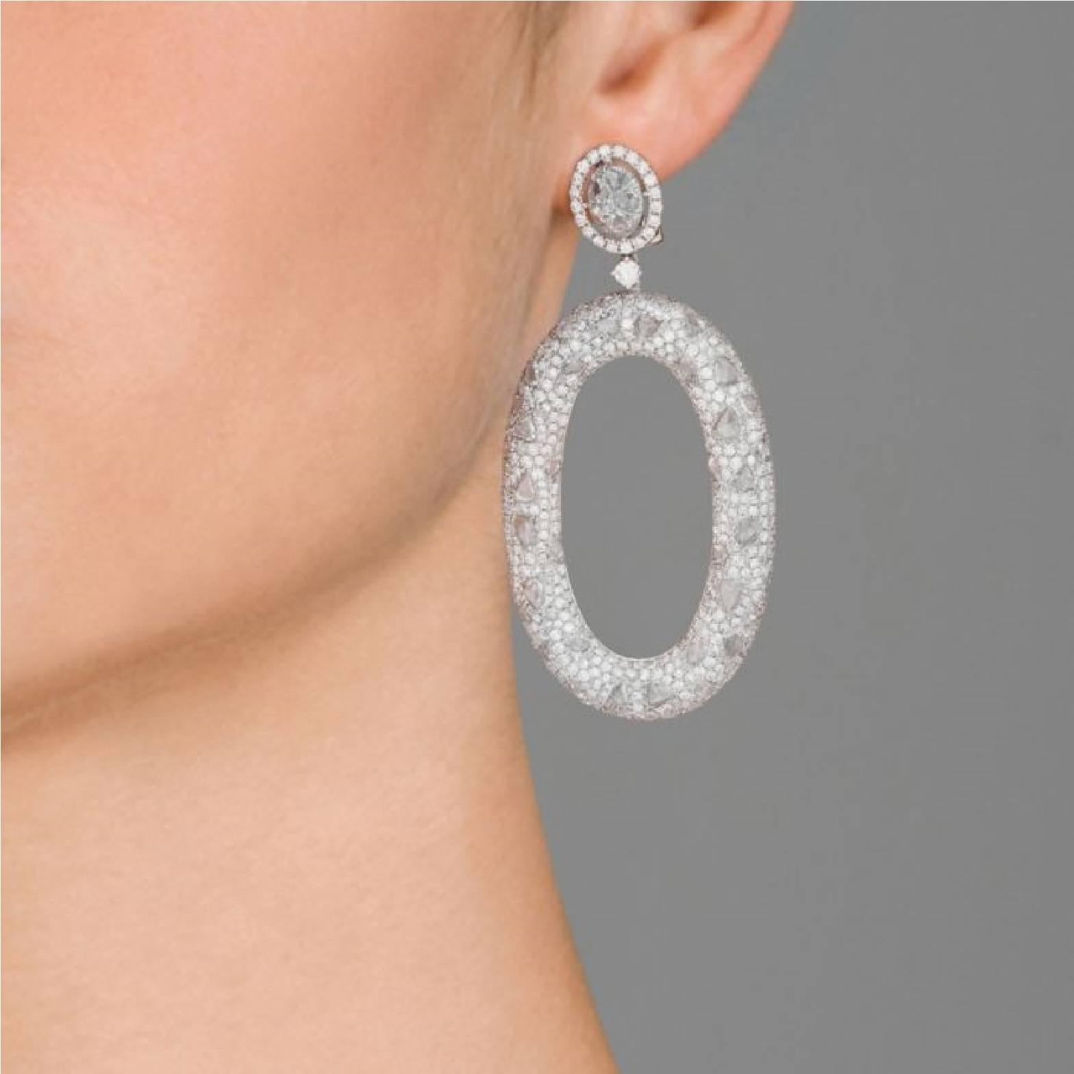 Oval drop pave diamonds throughout
Faceted diamond oval post with pave border
Round cut diamond at link
Omega back closure
Length of drop: 2.5