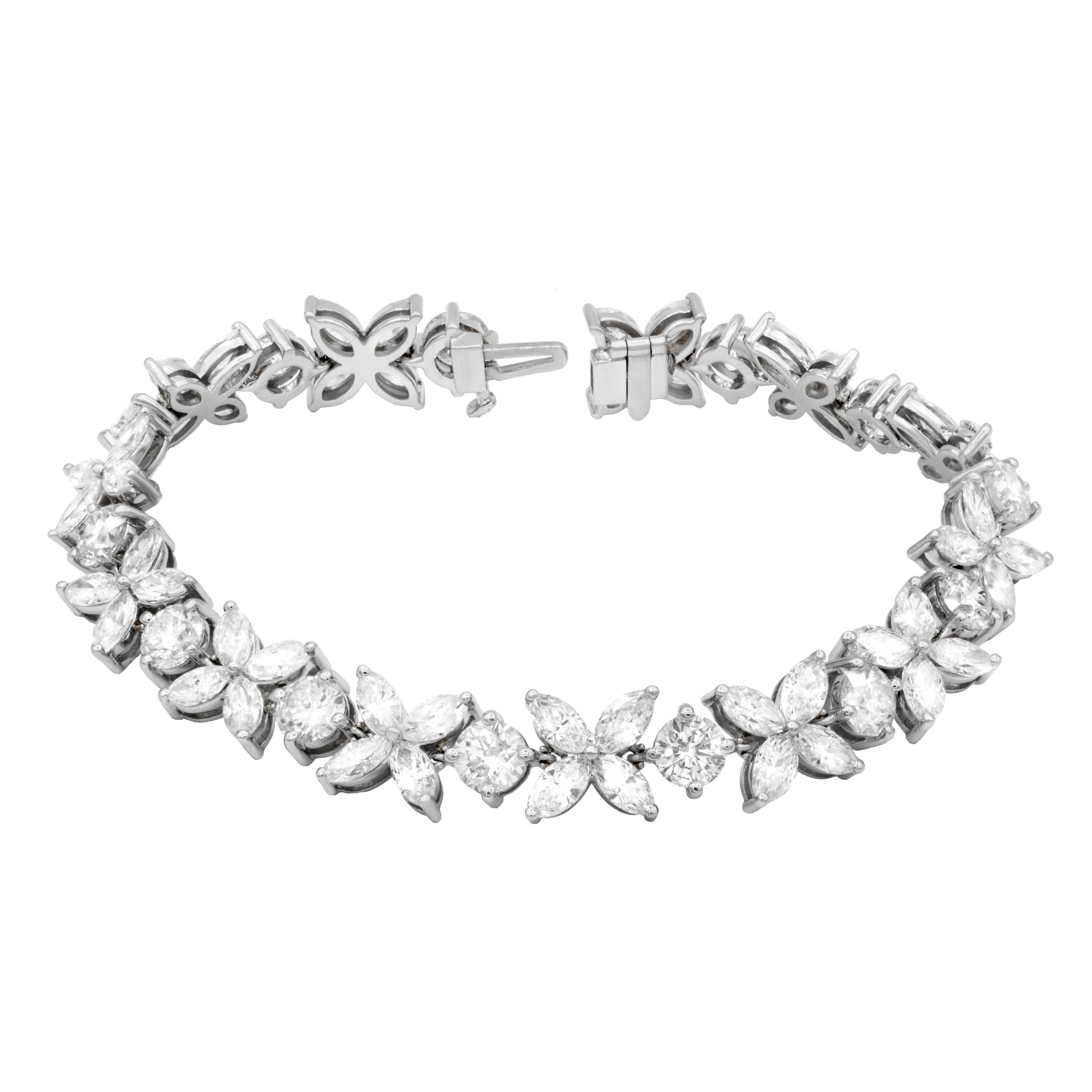 18K White Gold Cluster diamond bracelet with marquise and round diamonds. Features 20.02 Carats of marquise shape and round shape diamonds. Custom made 18K white gold mounting. 
Comes with certificate of appraisal.
