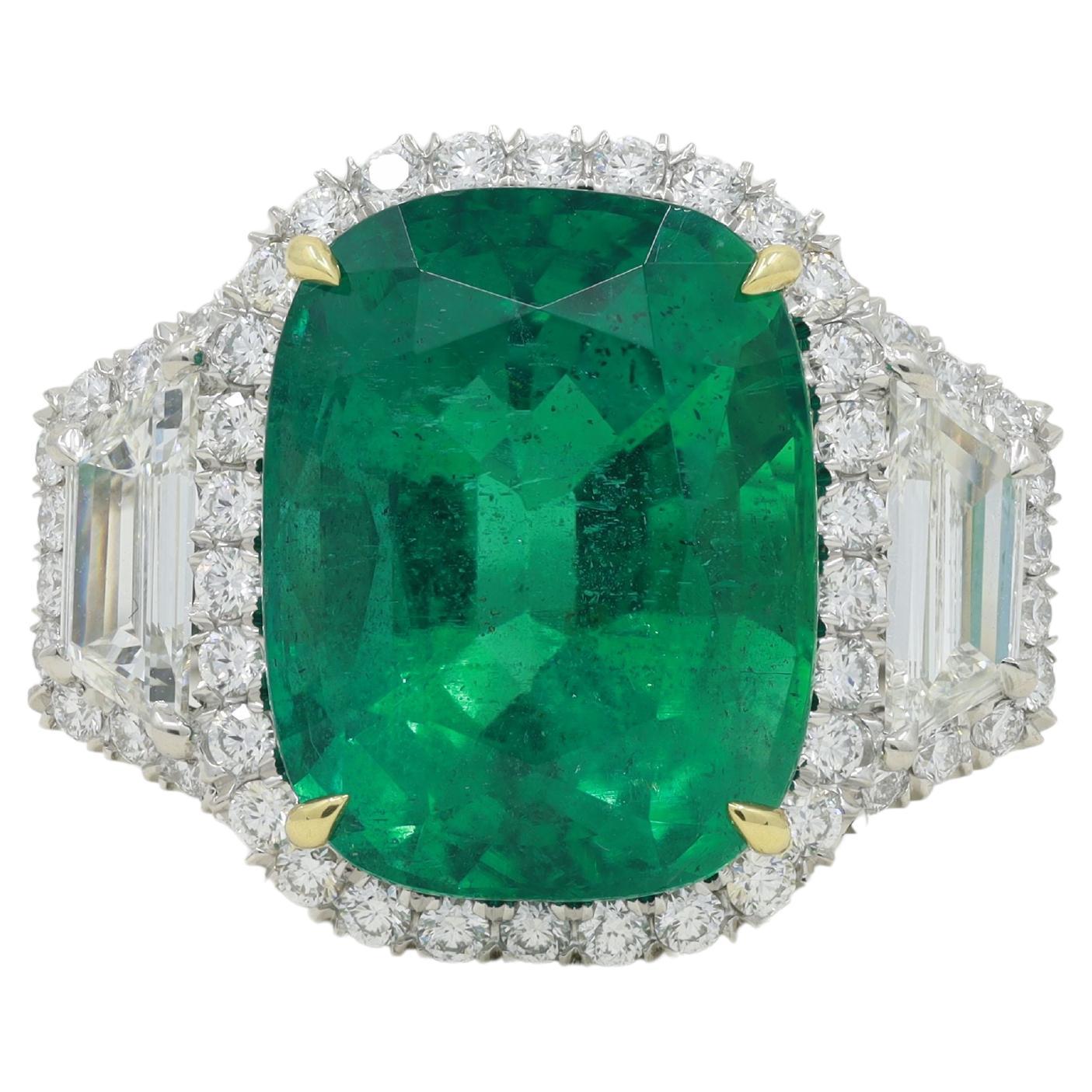 Platinum and 18 kt yellow gold emerald and diamond ring featuring a 11.22 ct cushion cut green emerald surrounded by diamonds and step trapezoids weighing 2.85 cts tw in a halo setting.
Diana M. is a leading supplier of top-quality fine jewelry for