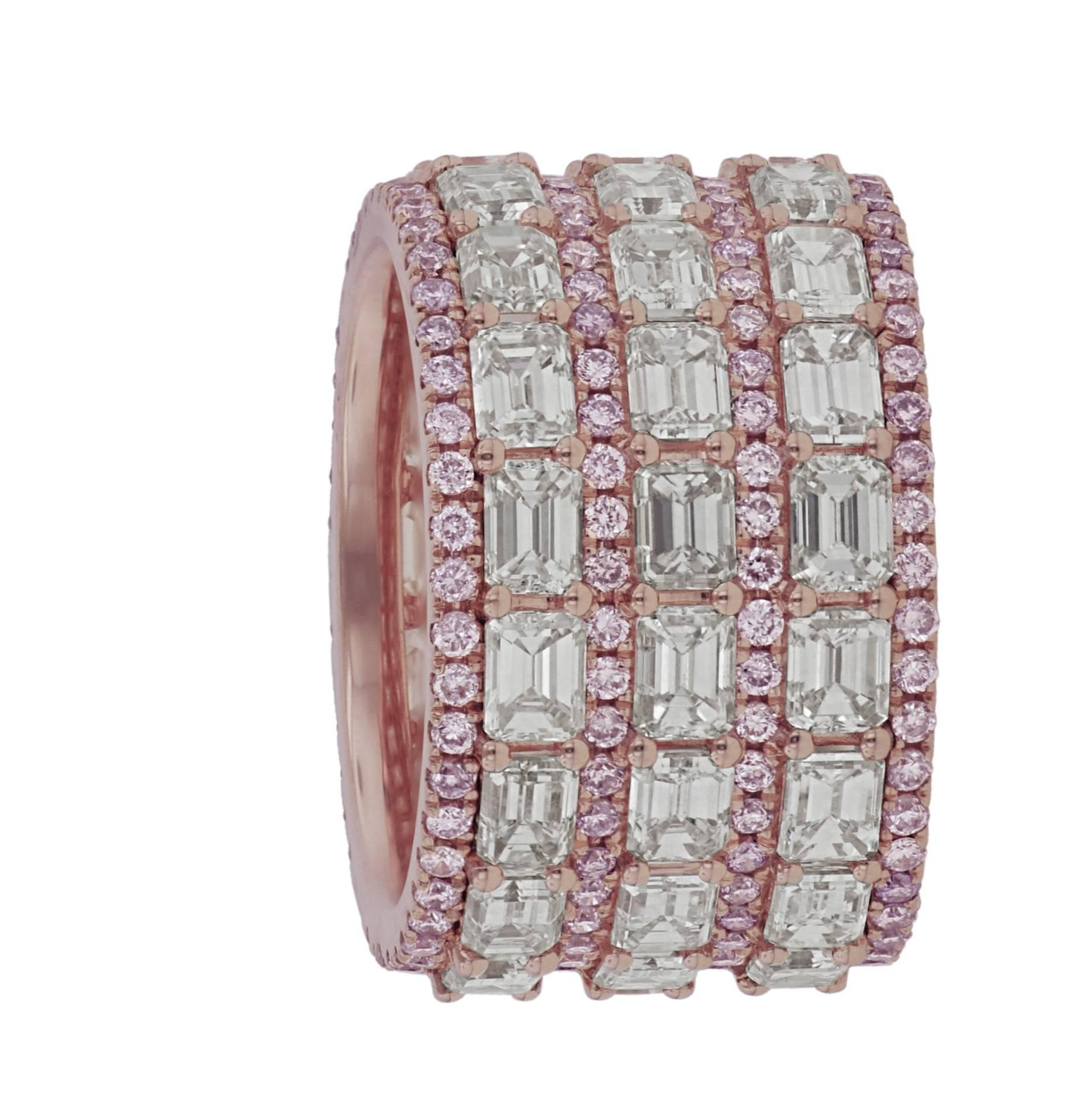 Natural Pink and White Diamond Band, features 11.23 Carats of Emerald cut diamonds, surrounded by Natural Pink Round Brilliant Cut Diamonds. Set in 18KT Rose Gold. 

