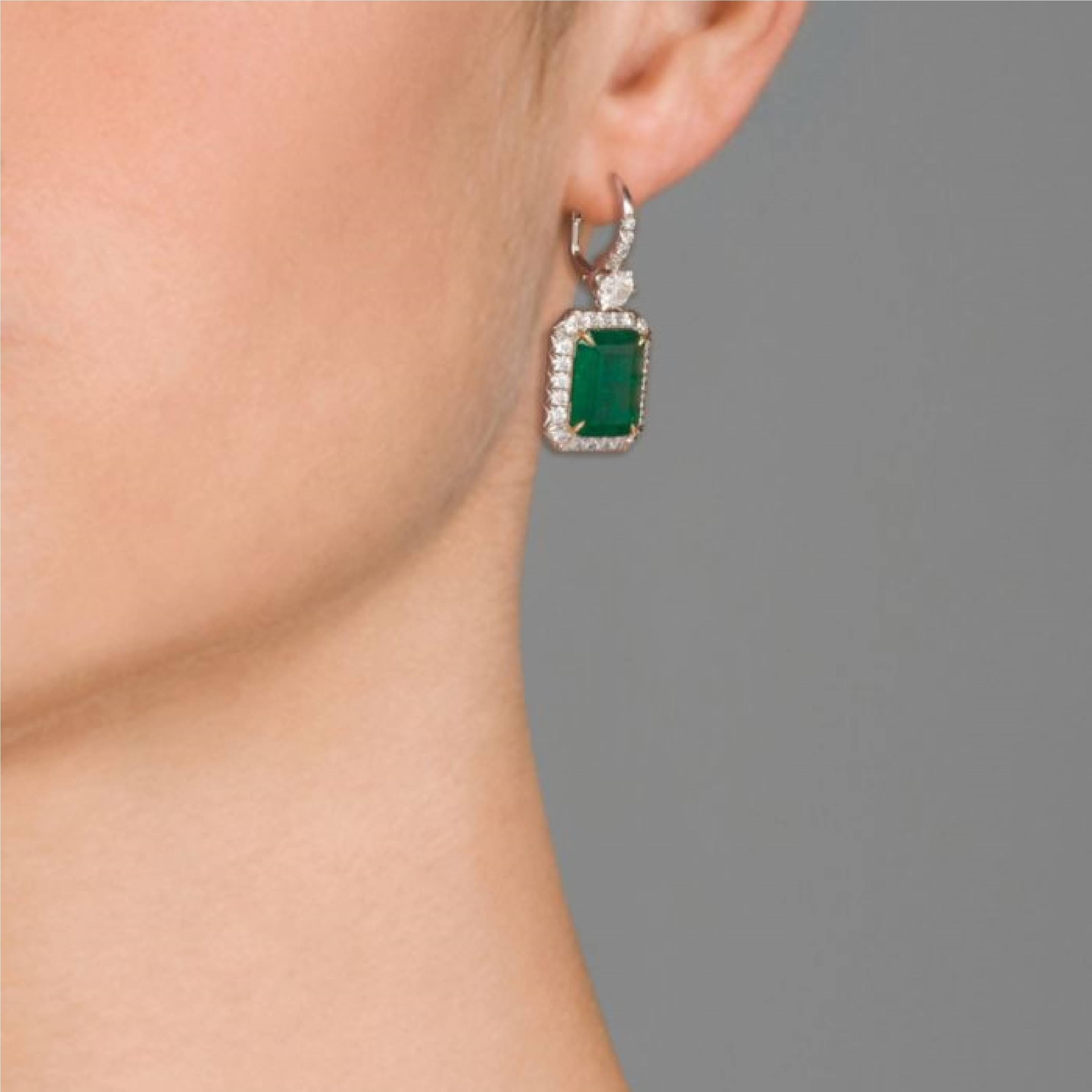 These 18 KT white gold and yellow gold fascinate Colombian Emerald Earrings, features two square  Emeralds, the total weight of 8.35 Carat, 
The Emeralds surrounded by 2.40 Carats of round brilliant cut diamonds. 

The craftsmanship is outstanding. 