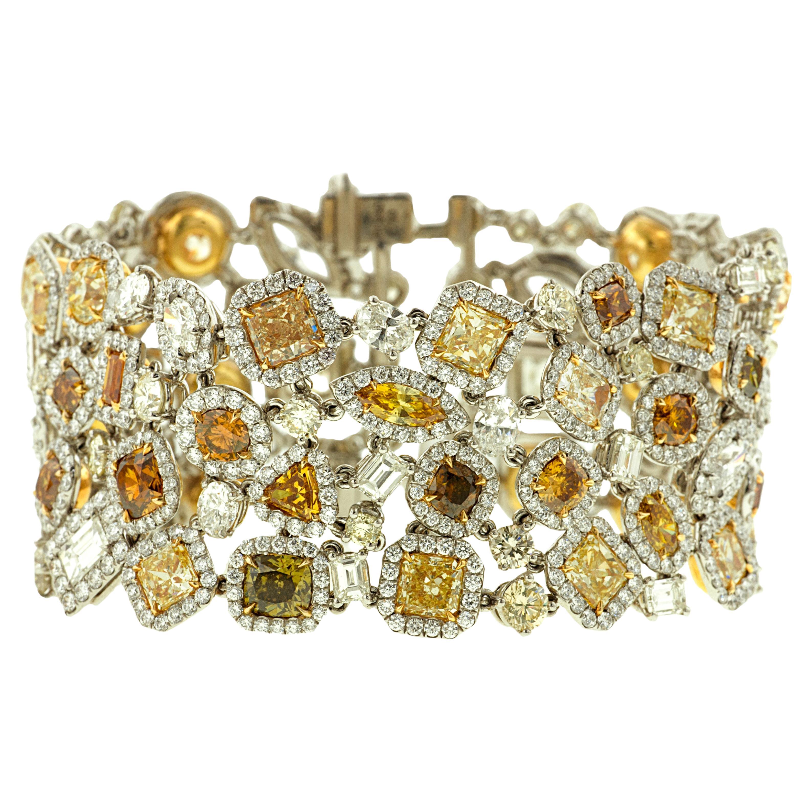 Diana M. Platinum multi-colored and multi-shaped diamond bracelet featuring 58ct For Sale