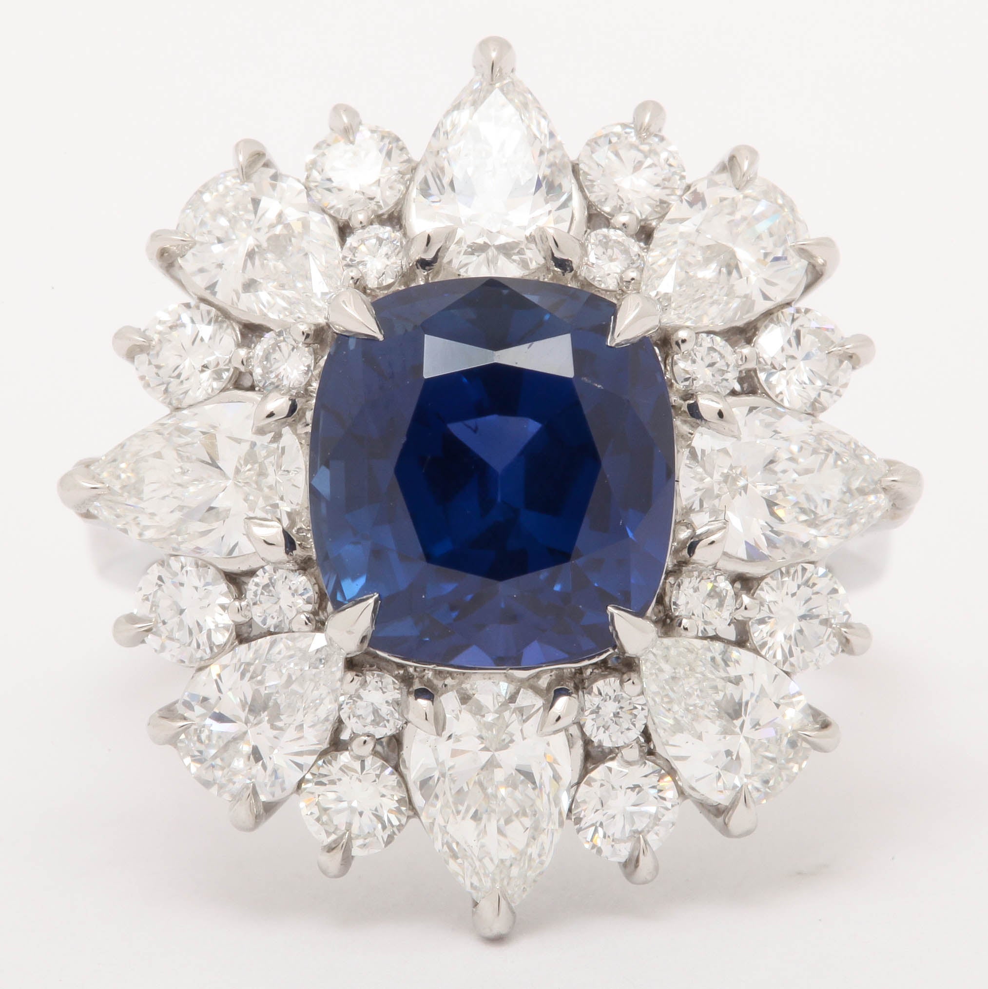 This magnificent sapphire and diamond ring, features 5.98 Carat Unheated Burmese Sapphire, GIA Certified. set with 3.04 Carats of multi shape diamonds.