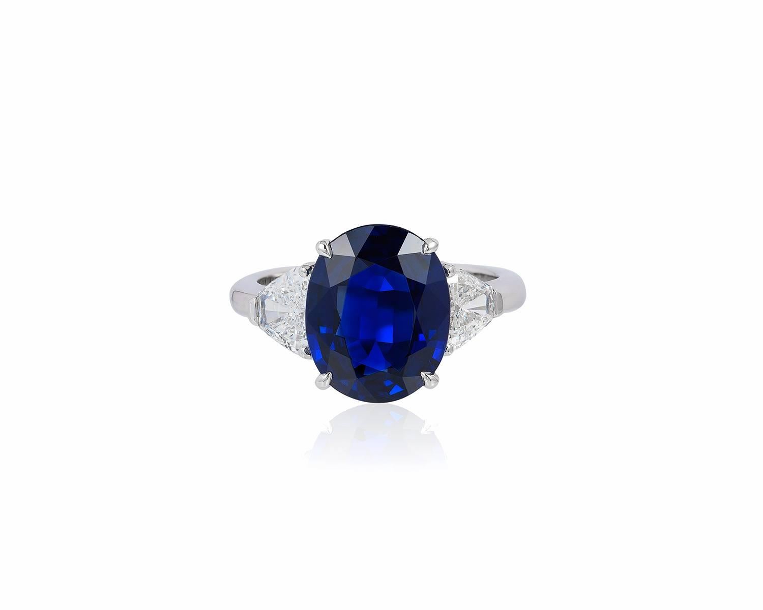 This ring is features a beautiful oval blue sapphire weighing 4.87 carats flanked on either side by shield shaped diamonds, all mounted in 18-karat white gold.
Ring size: 5.5