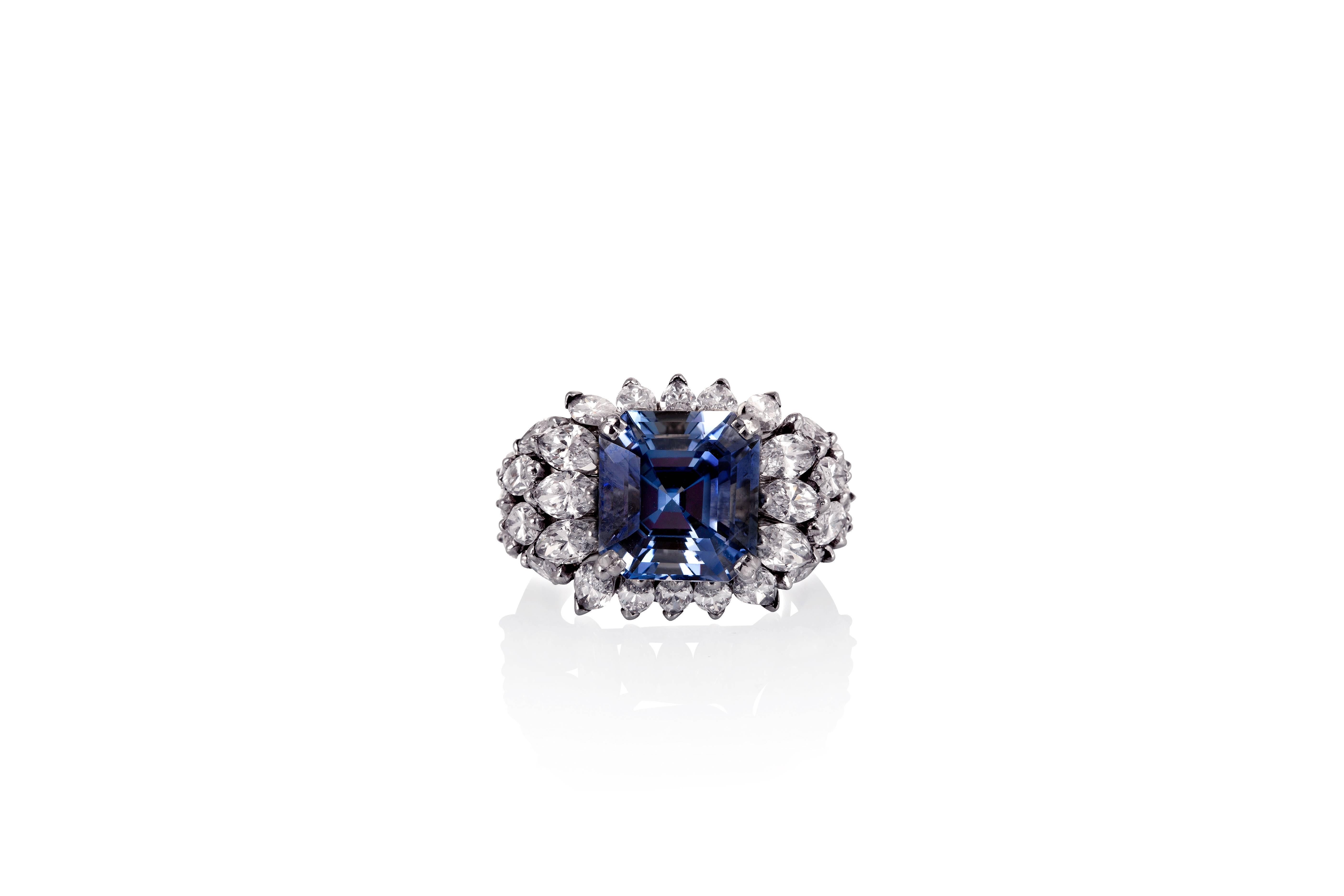 Centered on an emerald cut blue sapphire weighing 8.02 carats, this ring is enhanced by a cluster of 30 marquise diamonds weighing an estimated 4.1 carats, mounted in platinum.
Ring size: 6.5
