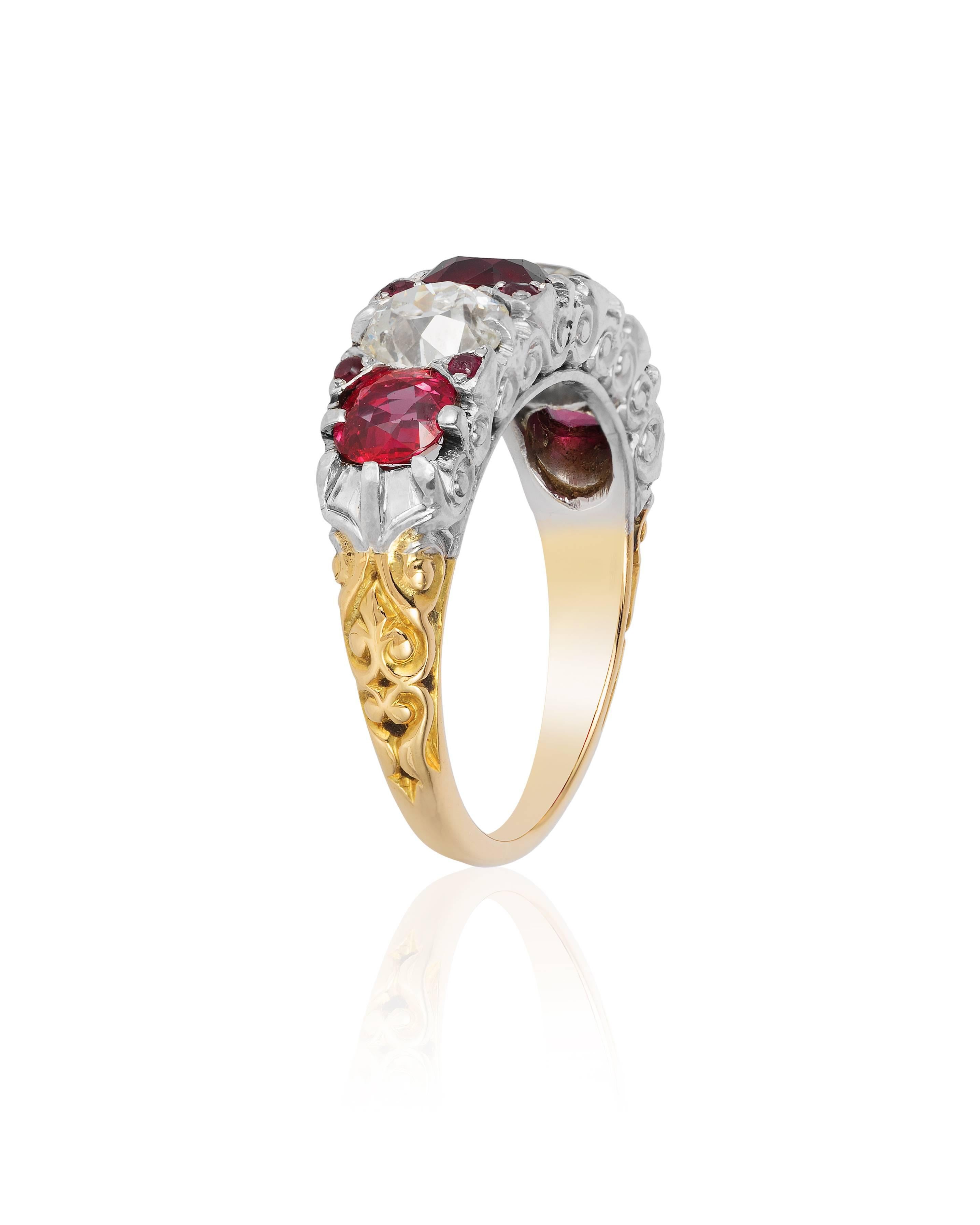 Beautifully crafted, this ring by Tiffany features 3 beautiful Burmese rubies of superb color and clarity weighing approximately 1.8 to 2.2 carats and two Old European diamonds weighing approximately 1.0 to 1.5 carats.  The ring is further enhanced