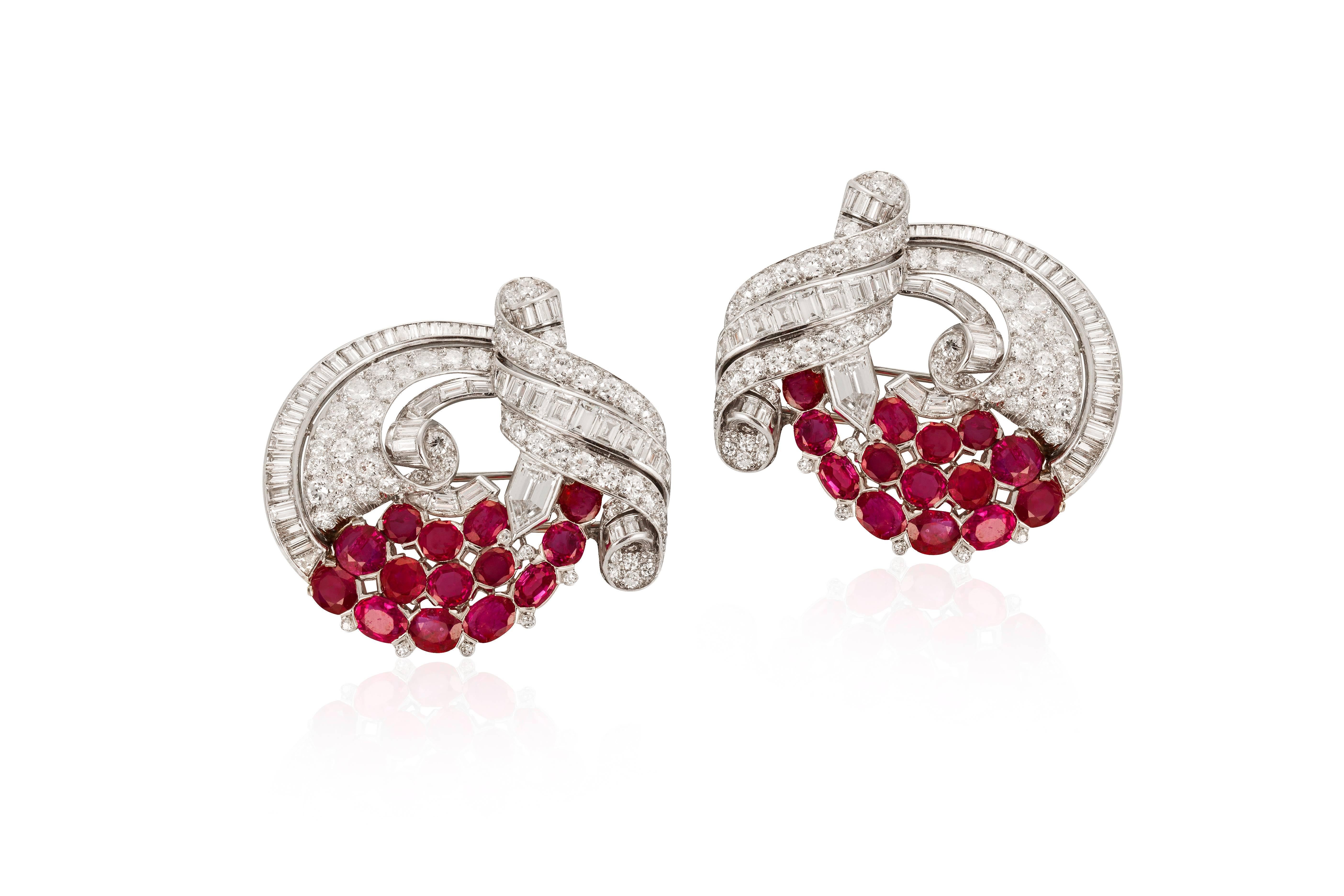 Two matching clips featuring exceptional rubies weighing an estimated 12.60 carats and baguette and round diamonds weighing an estimated 15 carats can be worn individually or combined to form a single very important pin.

Dimensions: 	3” x 1 ⅞”