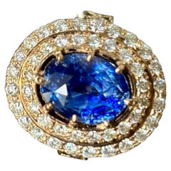 Bague en or 18 carats avec saphir naturel de Ceylan de 7,20 carats et halo de diamants, certifiée GIA