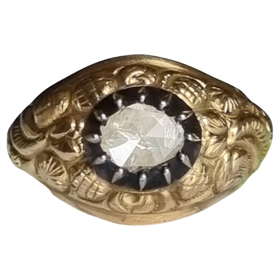 Early Victorian Era Rose cut Diamond  Men Ring (1837-1860)
Antique Victorian Era Diamond Men’s Ring.
The 14K/15K yellow gold (touchstone tested) ring is centered with a rose cut diamond in a pinched collect silver setting, surrounded by finely
