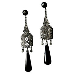 A Pair of Onyx and Diamond Earrings. Art-Deco Style. Mounted in Platinum.