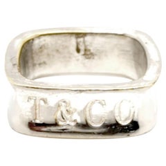 Tiffany & Co. T & Co. 1837 Anillo de boda cuadrado de plata de ley Sz 7