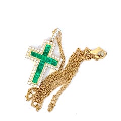 Croce Brillante con Smeraldo Panshir AAA+ verde brillante con catena in oro giallo 750