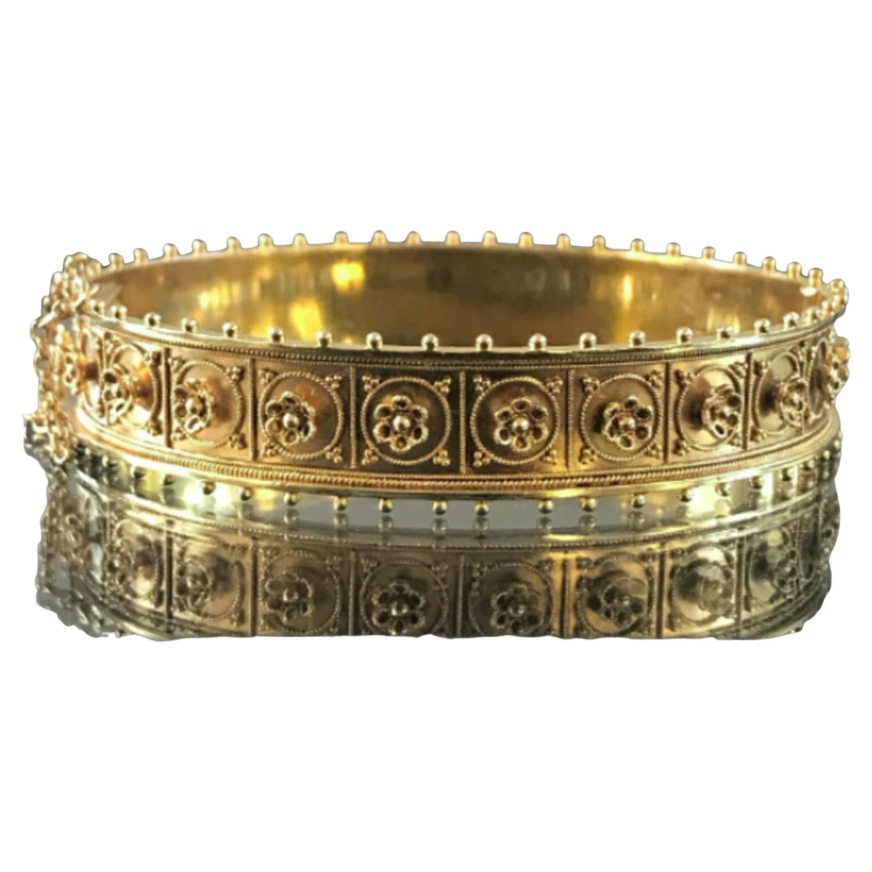 Etruscan Revival 15 Karat yellow gold Granulation Bracelet weighting 23 gram, flower pattern, no damage, made in 1880s. Fits 7-7.5 inch wrist, 1/2 inch wide in excellent condition considering its 140 years of age, marked 