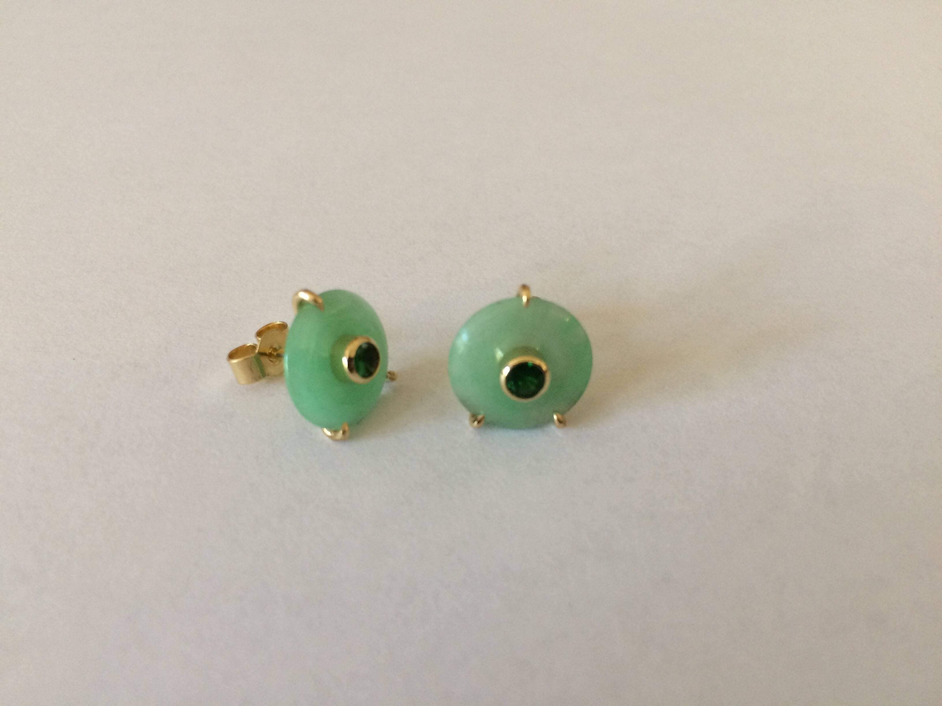These studs have been handcrafted in our London workshop in 18ct yellow gold and are set with vivid round brilliant cut green tsavorites to emphasise the green in the jade. 

They total 0.20ct and are for pierced ears with scroll fittings.