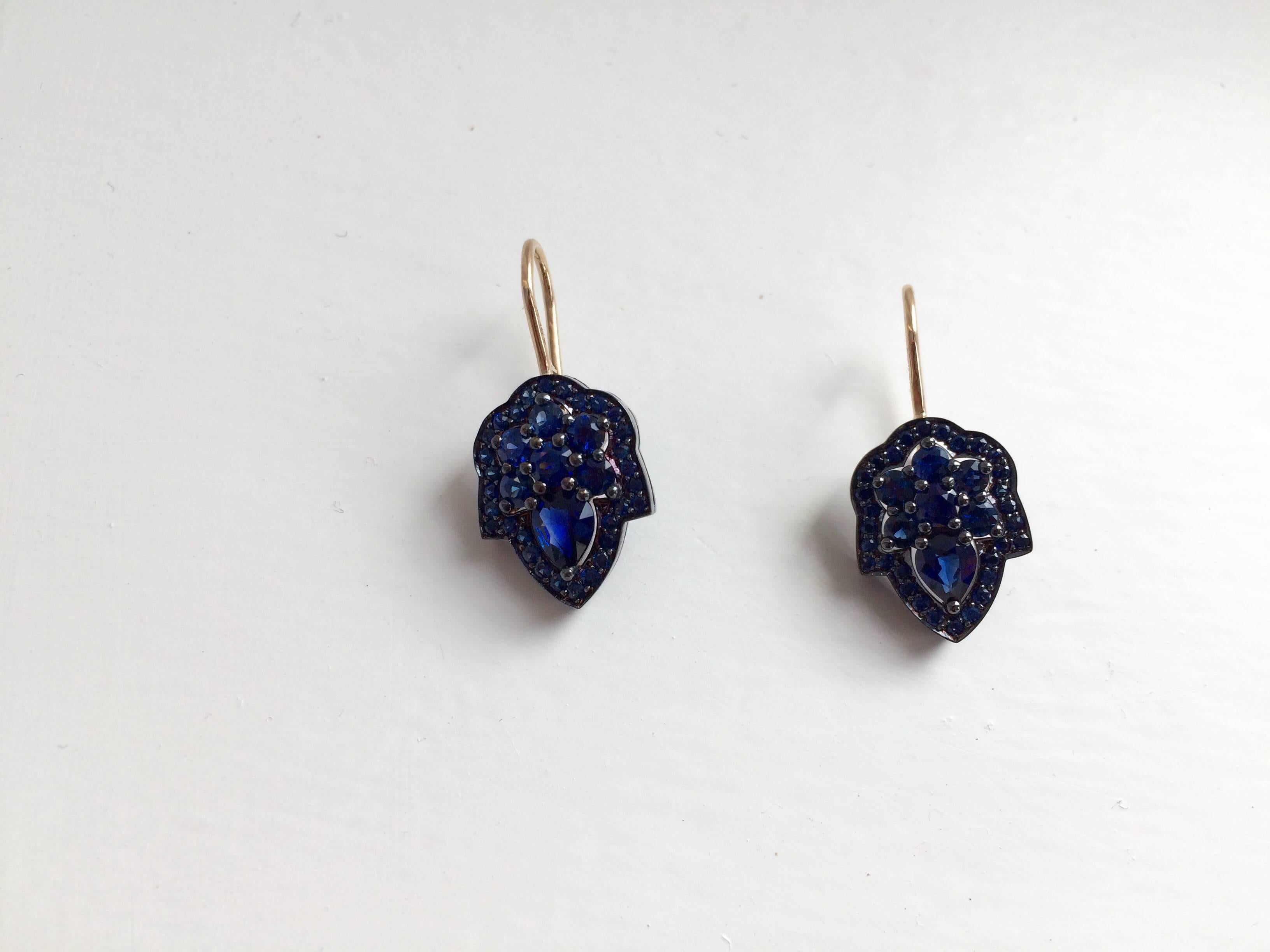 These earrings have been handcrafted in London from 18ct yellow gold and are set with 2.50ct of blue sapphires. The top and sides of the drops have been finished with a blue gold lacquer to enhance the electric blue colour of the sapphires.

Width