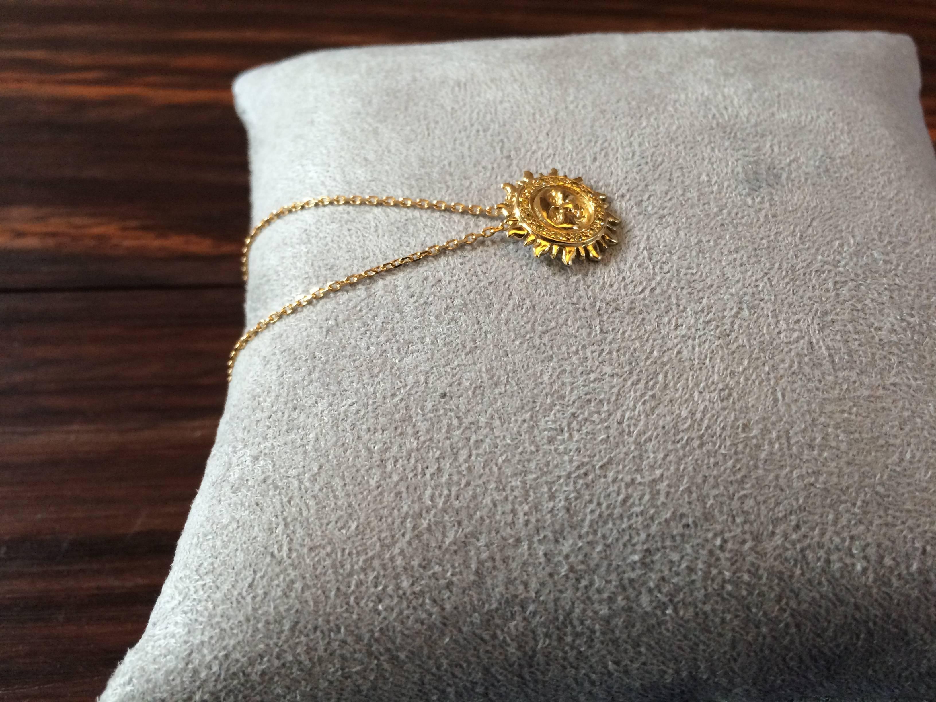 This pendant has been handcrafted from 18ct yellow gold and is pave set with 0.15ct natural canary yellow diamonds.

The total length of the chain is 40cm or 16 inches
Diameter of sun: 1.4cm

This piece is made to order and takes approximately 4