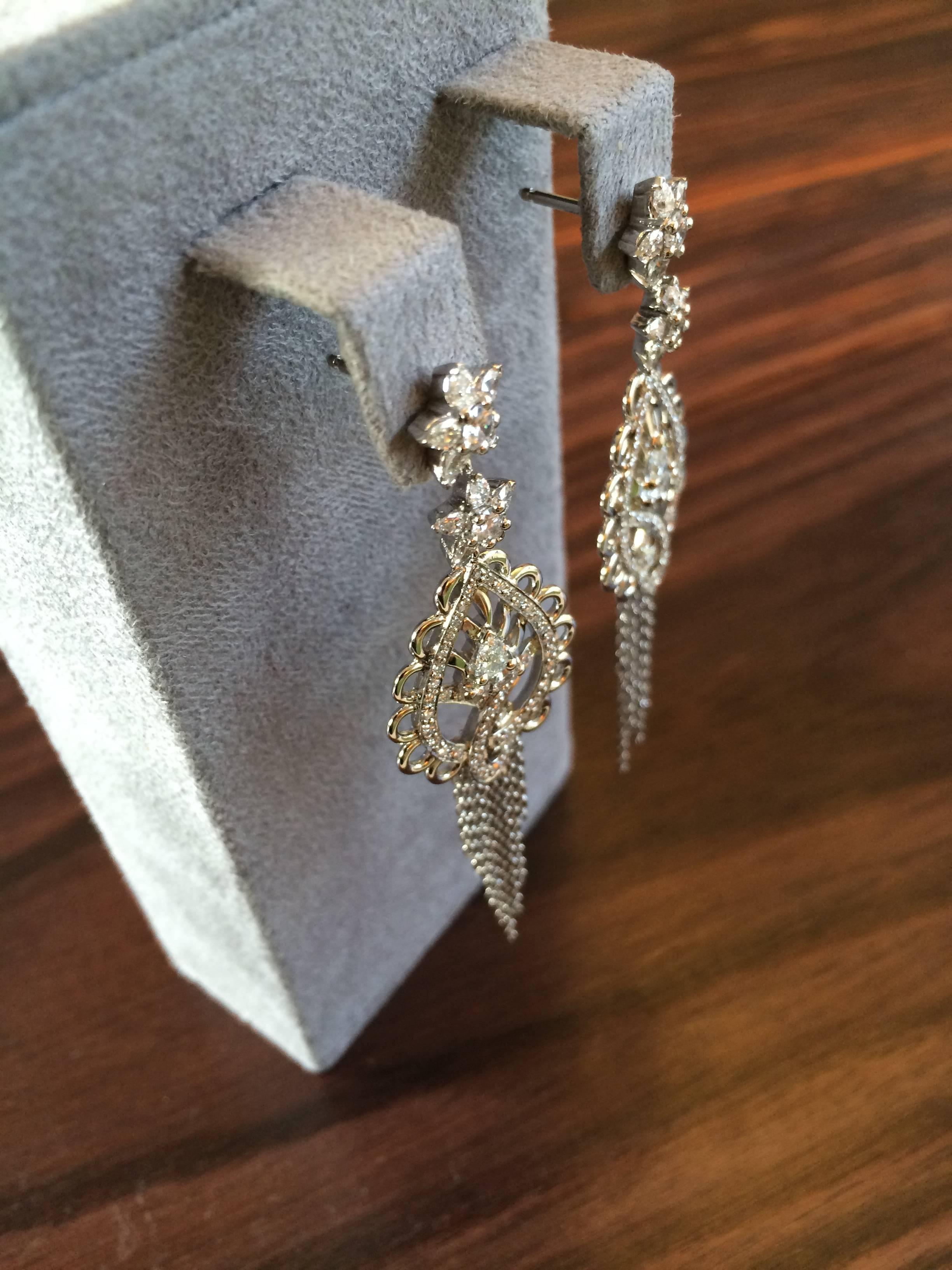 These earrings are hand crafted in platinum and hand set with 2.30ct white diamonds, e/f colour and Vs clarity. 

Diameter: 2cm
Length at the longest point: 7.2cm

These earrings have been crafted in our London workshop and are part of the Ana de