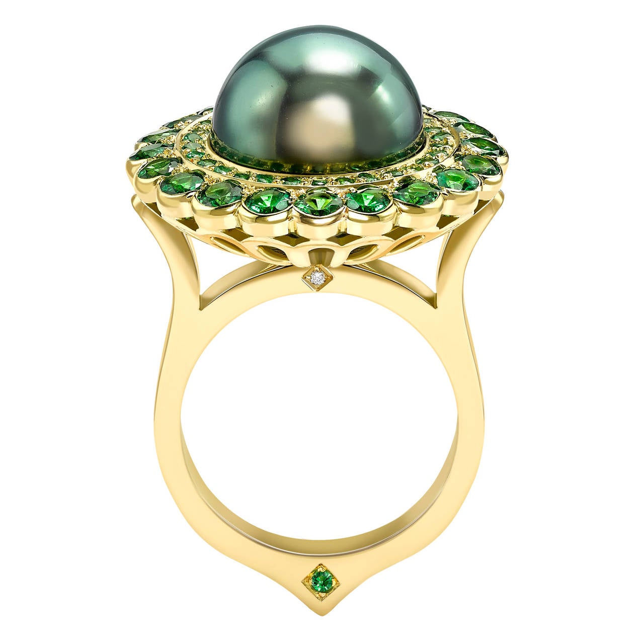 This ring is handcrafted from 18ct yellow gold and is set with a rare 12mm grade A Tahitian pearl, with exceptional lustre and play of colour. It is a very unusual green hue and is also set with 2.45ct of green tsavorites. 

Diameter of top: 2 cm