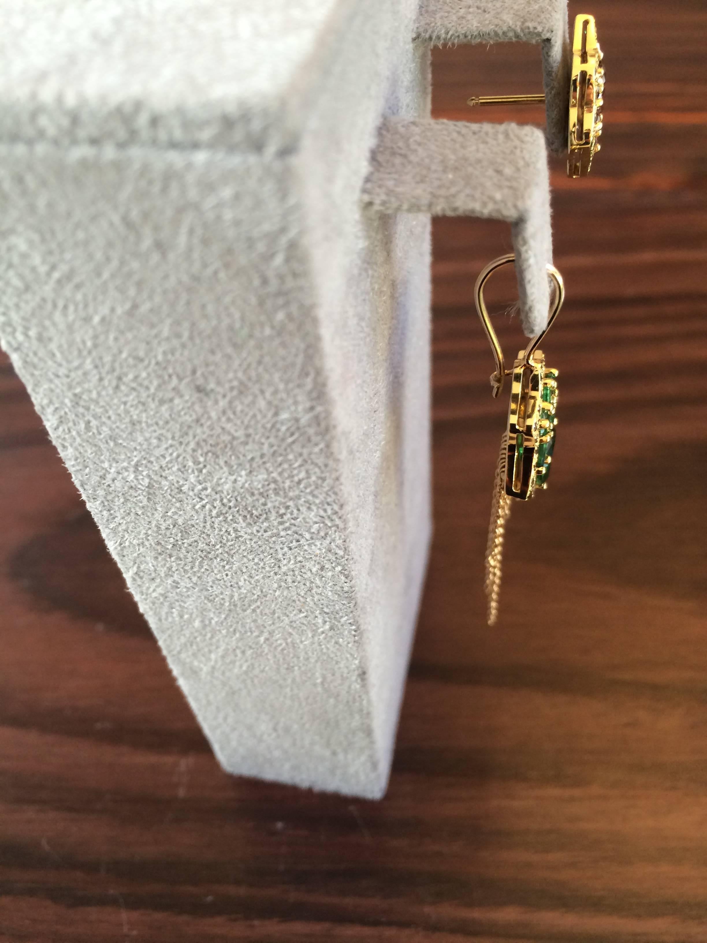 These earrings have been handcrafted in our London workshop from 18ct yellow gold and are a one of a kind piece.

The stud is designed to follow the shape of the ear upwards and is set with 0.80ct natural cognac diamonds and 0.25ct tsavorites.