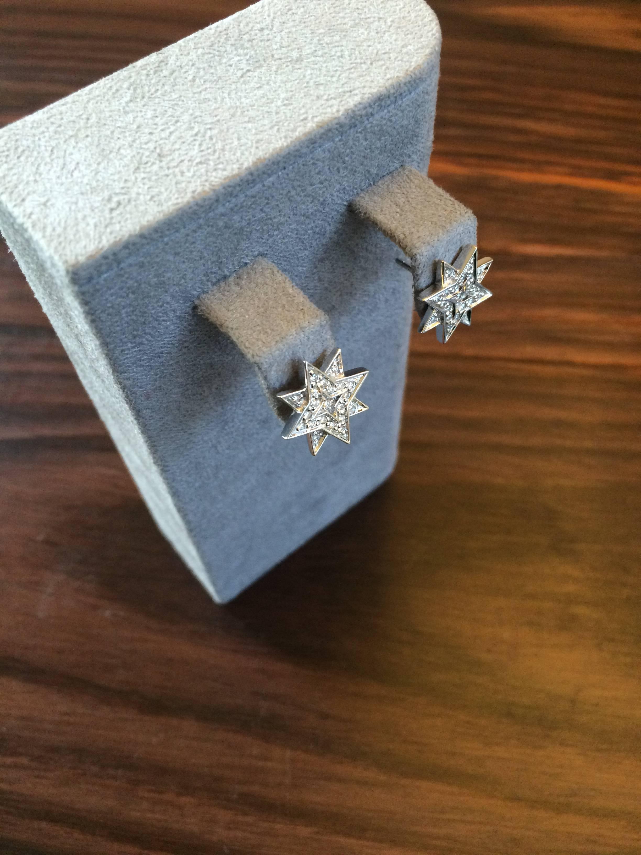 These studs are hand crafted from sterling silver and are pave set with white diamonds, totalling 0.30ct. They are f vs in quality. 

Diameter of star: 1.4cm

They are part of the Ana de Costa's 'Alchemy' collection which is inspired by ancient