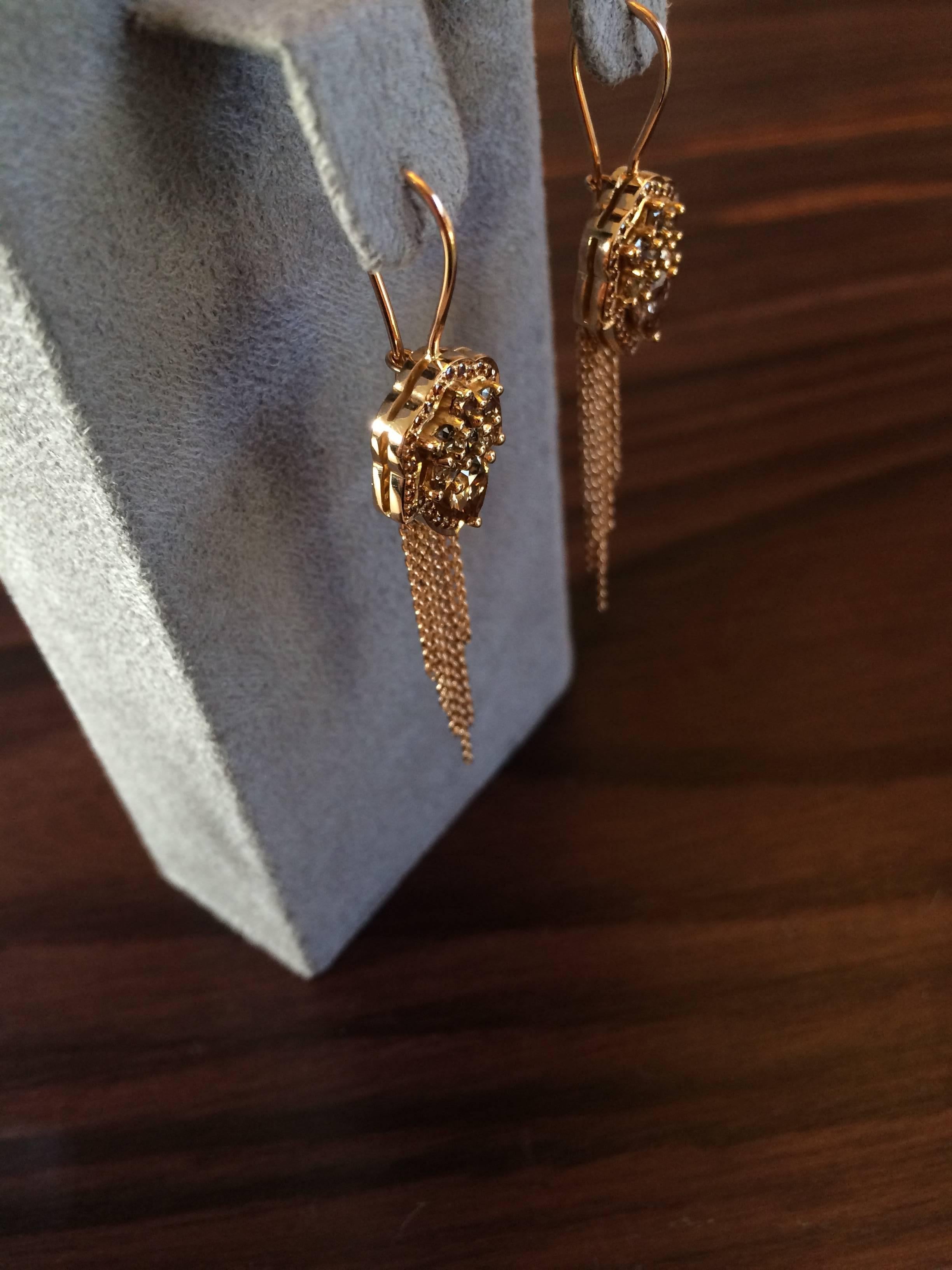 These earrings are hand crafted from 18ct rose gold and set with natural cognac diamonds which total 2.06ct. The chain tassels are diamond cut meaning that they sparkle in the light and move freely.

Diameter: 1.4cm
Length at longest point: