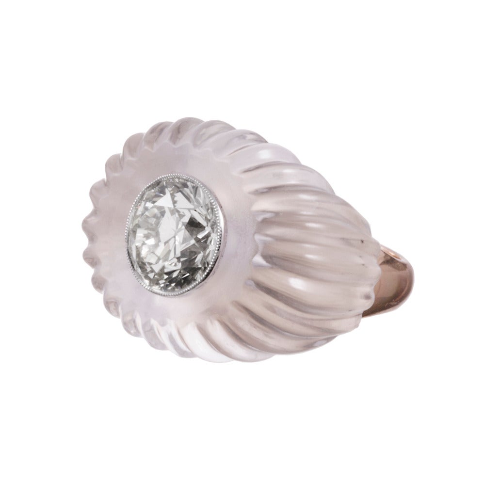 The ultimate cocktail ring to glamorize your party attire… with a large round brilliant diamonds set in the center of a large rock crystal “basket” with scalloped edges. The diamond weighs 5.32 carats and exhibits N-O color and Vs1-2 clarity. The