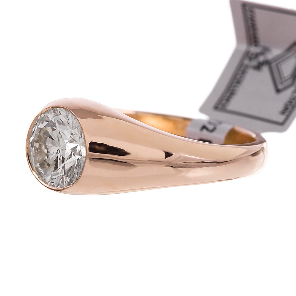 A classic favorite men’s style ring that is also popular with ladies, this gypsy ring is a comfortable and elegant way to showcase your diamond solitaire. Set in 14k yellow gold, the 1.83 carat brilliant round solitaire diamond grades L-M color and